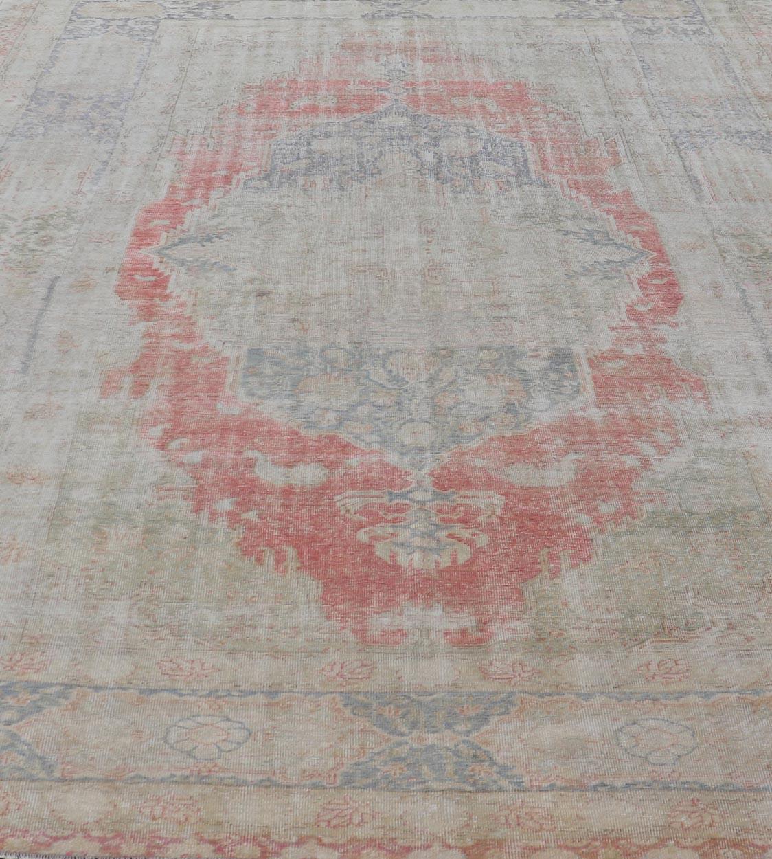 Measures: 9'7 x 13'7 
Antique Hand Knotted Turkish Oushak with Large Medallion in Off White and Coral. Keivan Woven Arts / rug EN-179974, country of origin / type: Turkey / Oushak, circa 1920. 
This large antique Turkish Oushak rug bears a off white