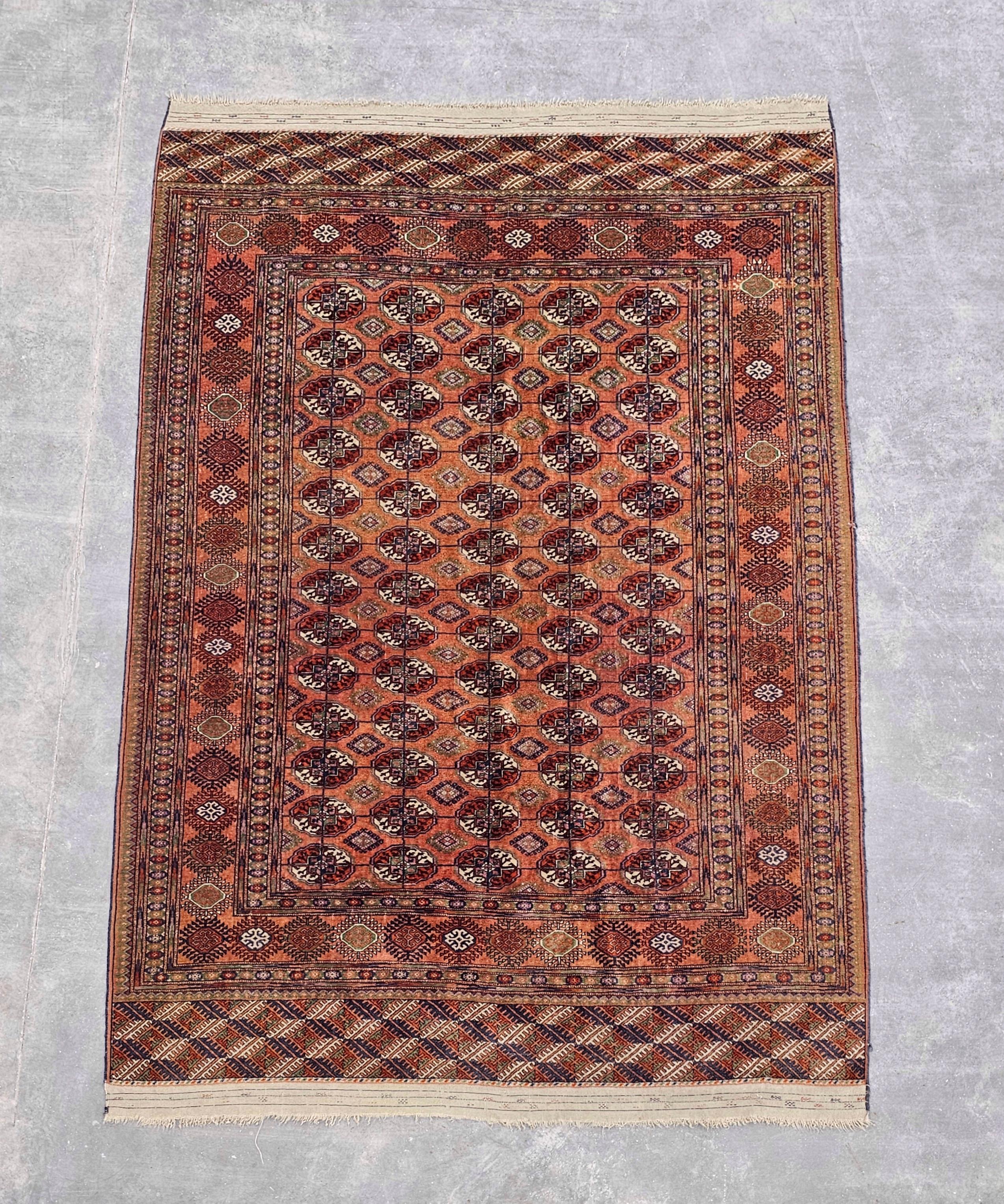 Early 20th Century Antique Hand-knotted Turkmen Bokhara Rug in brick orange/red, Turkmenistan 1920s
