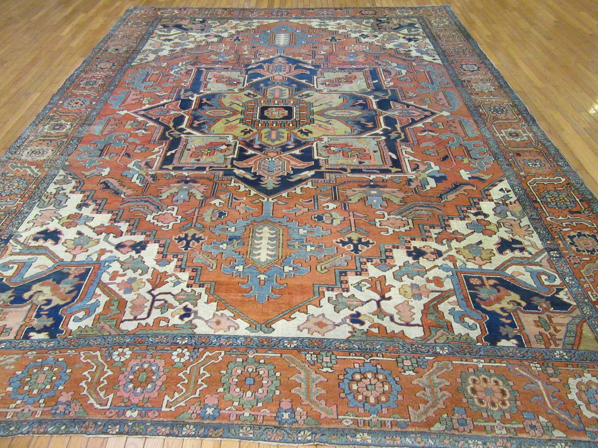 Antique Hand Knotted Wool Red and Blue Persian Serapi Rug For Sale 8