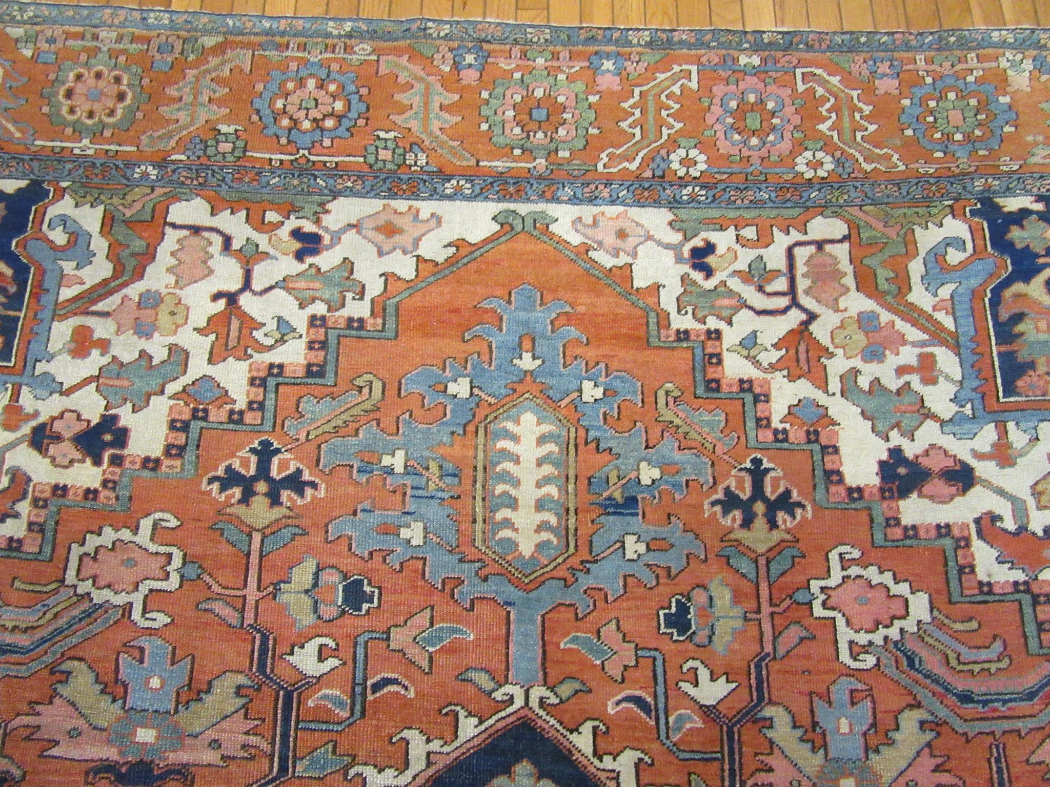 Antique Hand Knotted Wool Red and Blue Persian Serapi Rug For Sale 4