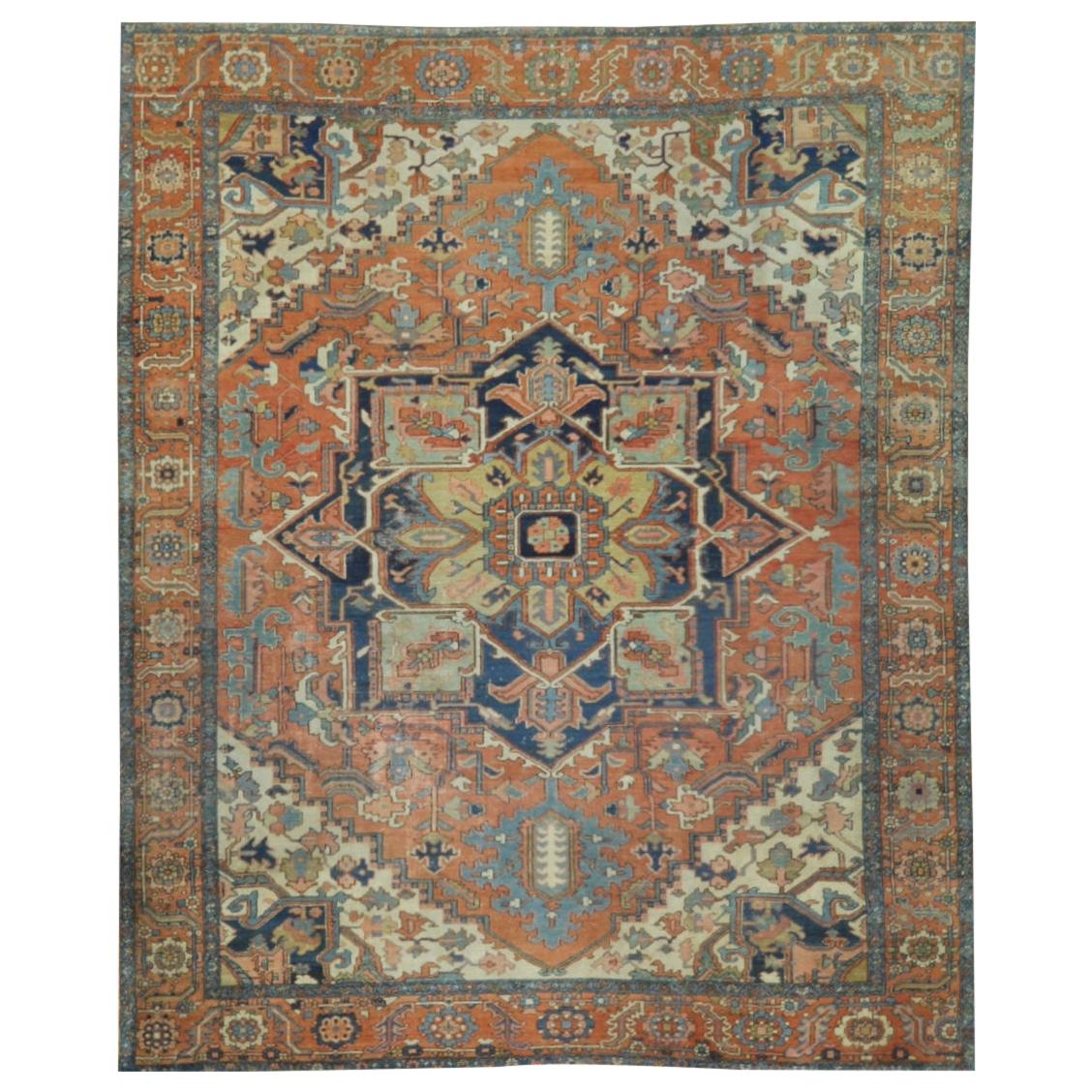 Antique Hand Knotted Wool Red and Blue Persian Serapi Rug For Sale