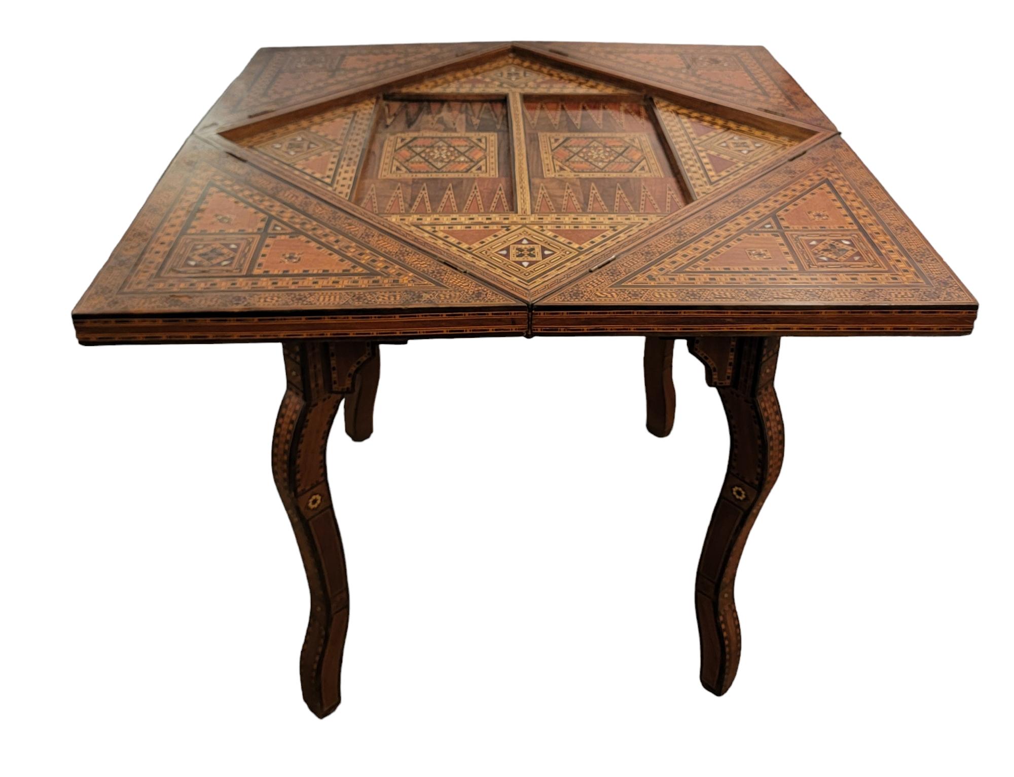 Antique Hand Made Inlaid Multi Game Table. Greta game table has multiple uses for Chess, Checkers, Backgammon, cards, etc. Table extends at the corners different angles of use. This may be adjusted to sit on a corner or float in the middle of a