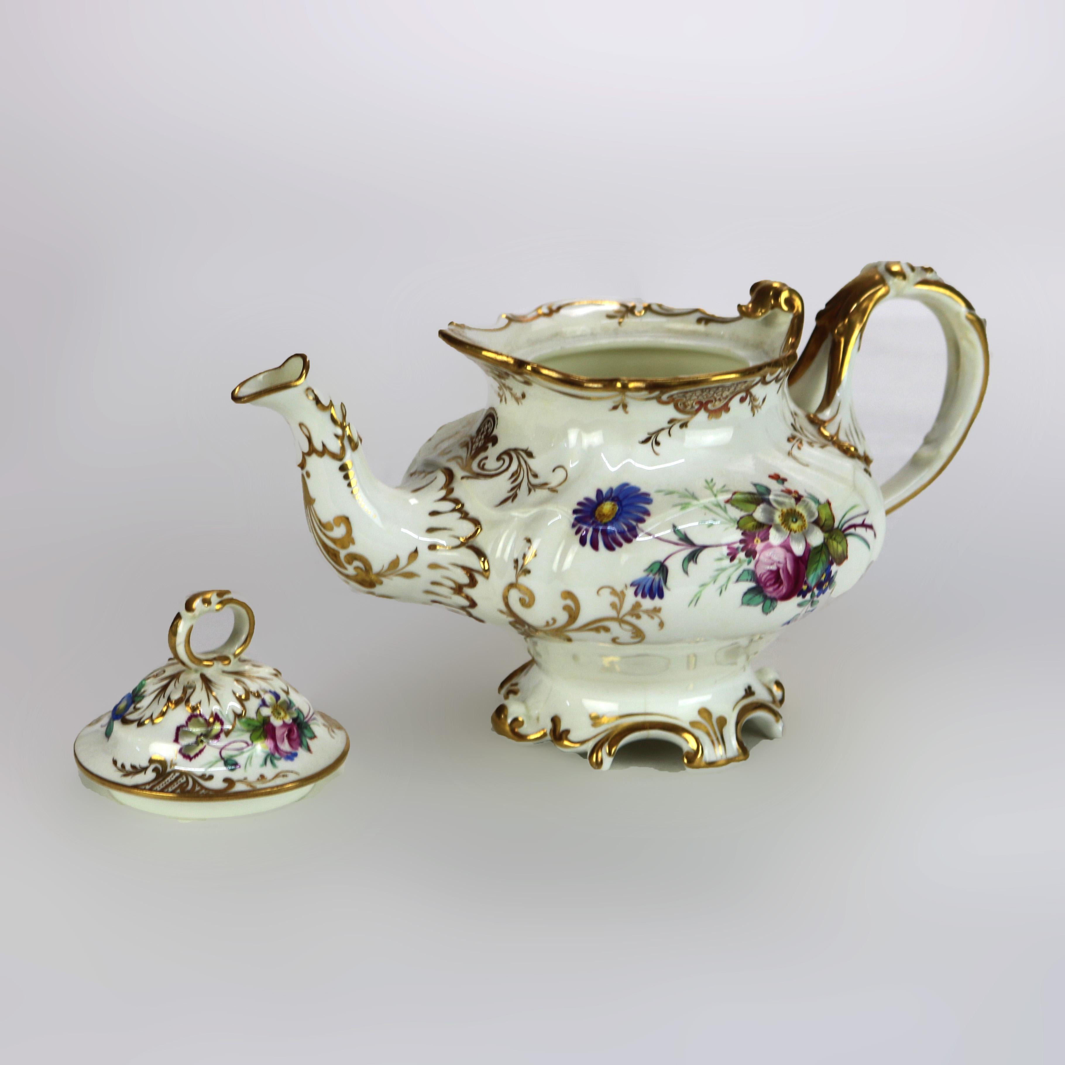 Théière ancienne en porcelaine peinte à la main et dorée C1890

Dimensions - 5,75 
