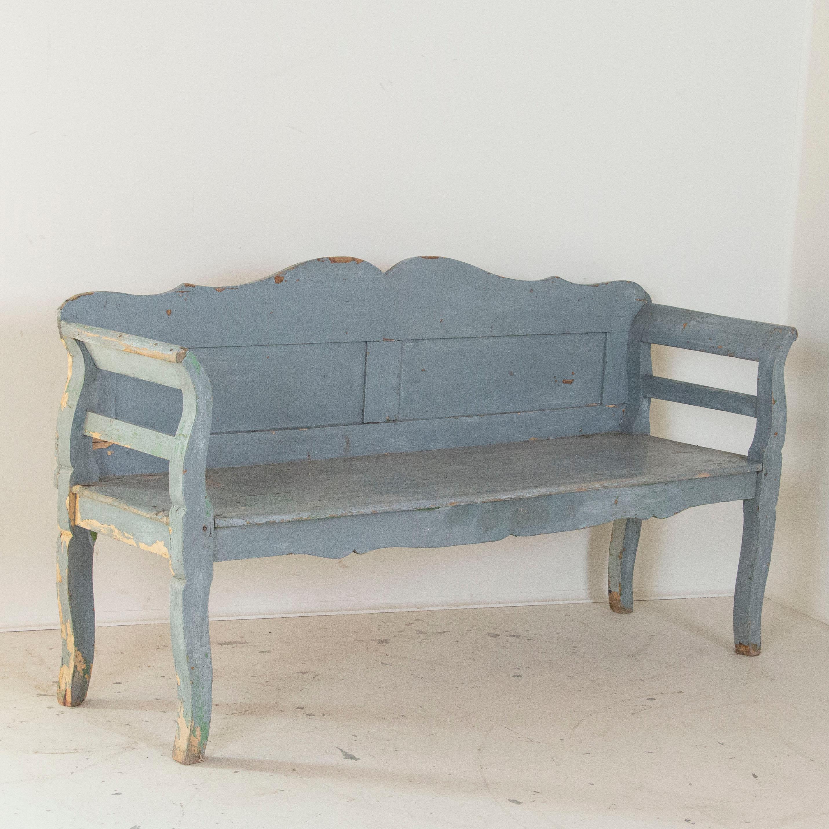 This delightful bench reminds one of a lazy summer day in the European countryside with blue skies above. The blue paint is all original, but has been naturally worn and distressed over time which adds to the character and charm of the bench. Please