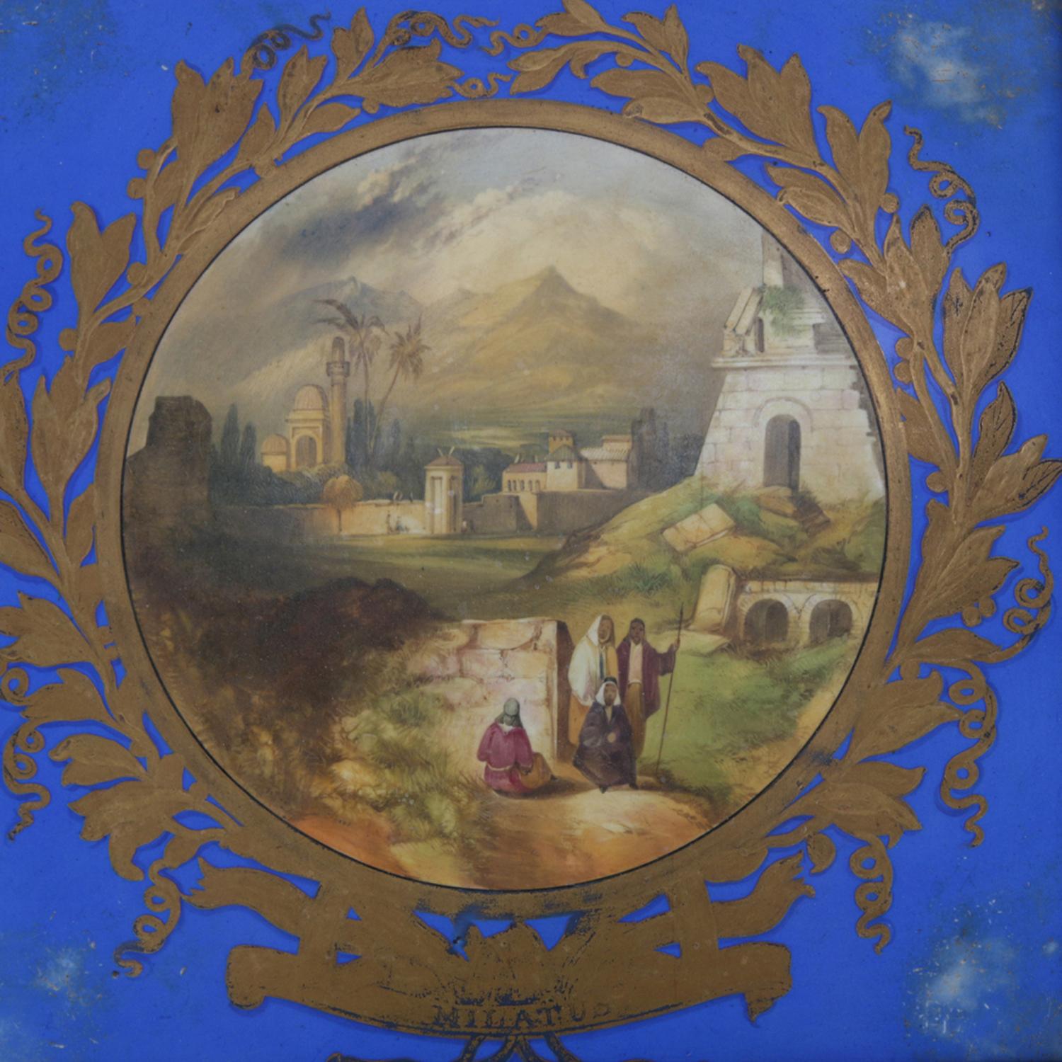 Antique Copeland porcelain plaque features hand-painted Orientalist Moorish cityscape scene with figures in gilt olive leaf surround with on cobalt ground having 