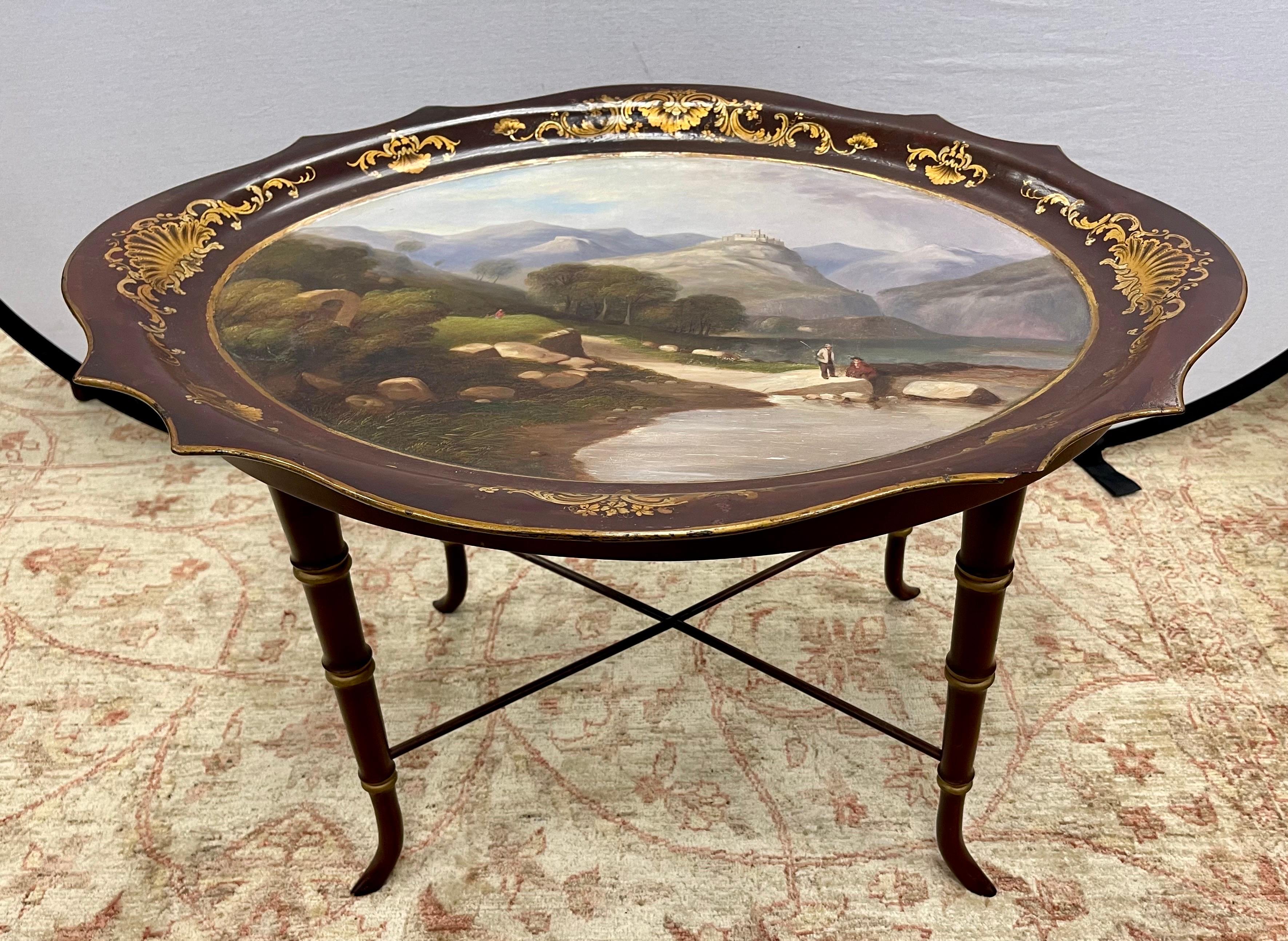 Stunning and rare papier mache top hand painted tray table with gorgeous painting. Not just a cocktail table, but a piece of art. The tray is removable and sits on faux bamboo legs. All dimensions are below. Why not own the best?