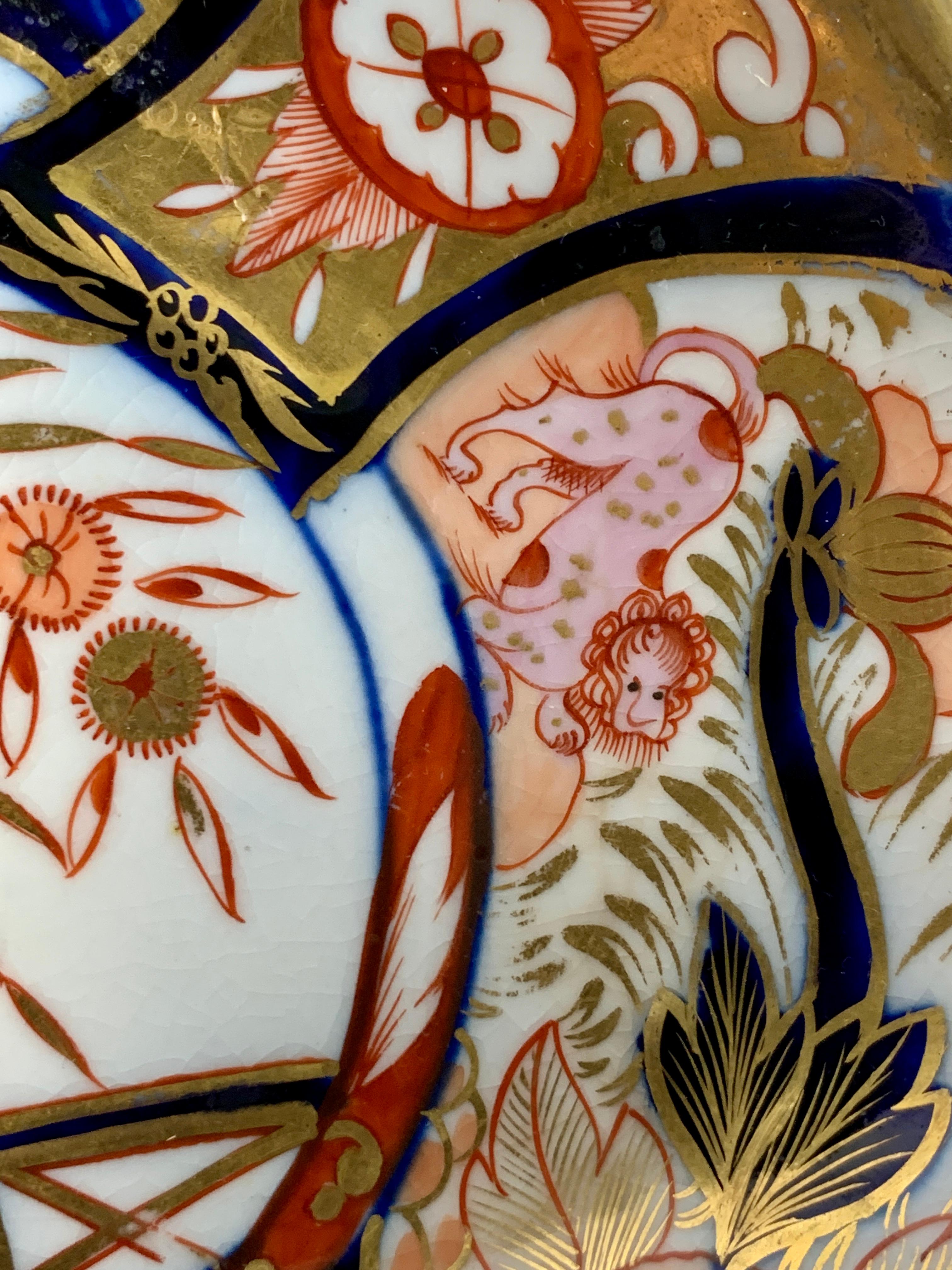 Why we love it: The intensity of the Imari colors and the fabulous pink spotted lion. 
This shell-shaped dish is hand-painted in the Coalport Admiral Nelson pattern. It was made in England during the Regency period circa 1810. The center scene