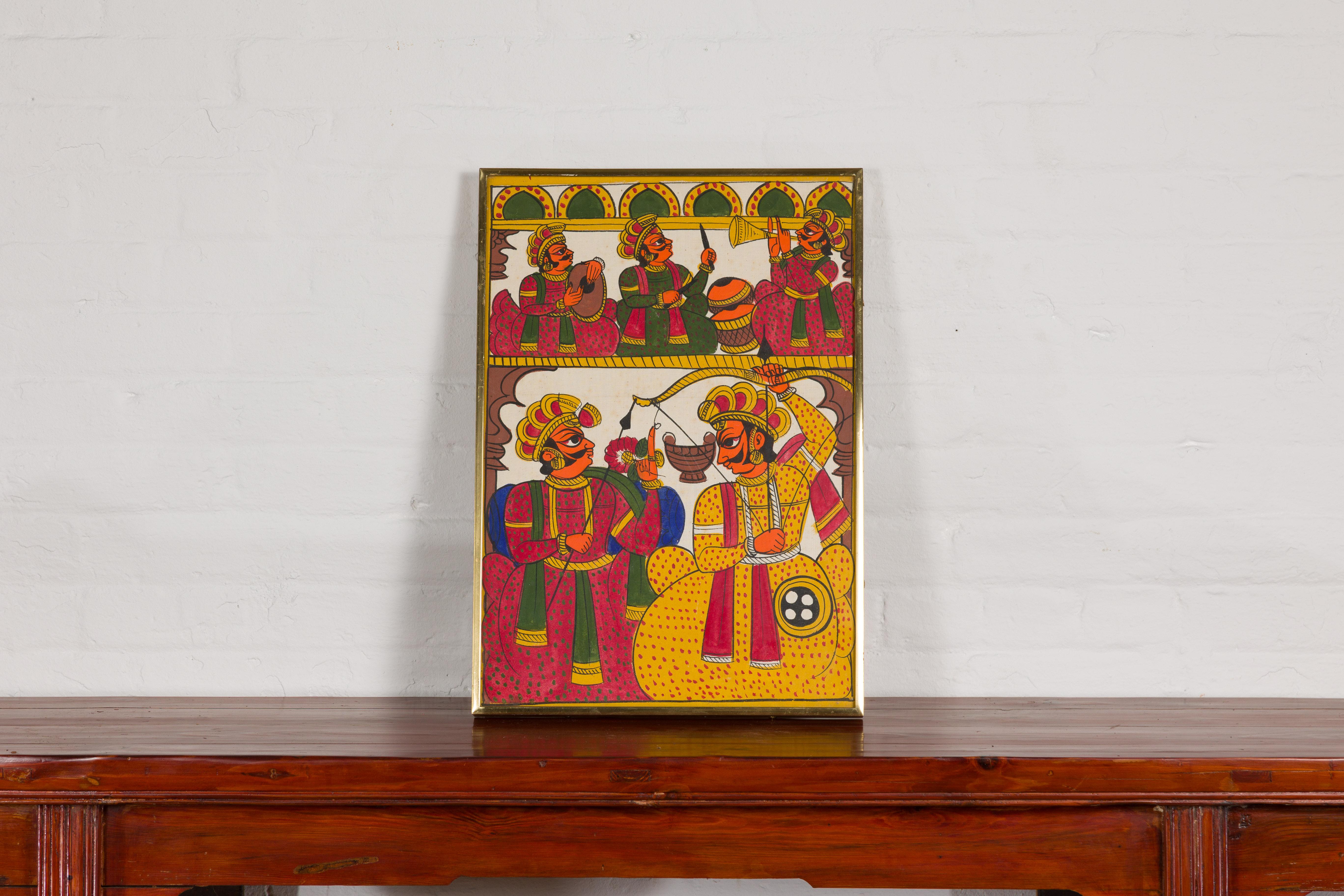 An antique Indian hand-painted folk art painting depicting musicians and archers in a brass custom frame. Step into a vibrant world of rhythm and archery with this antique Indian hand-painted folk art painting. Beautifully rendered, this artwork is