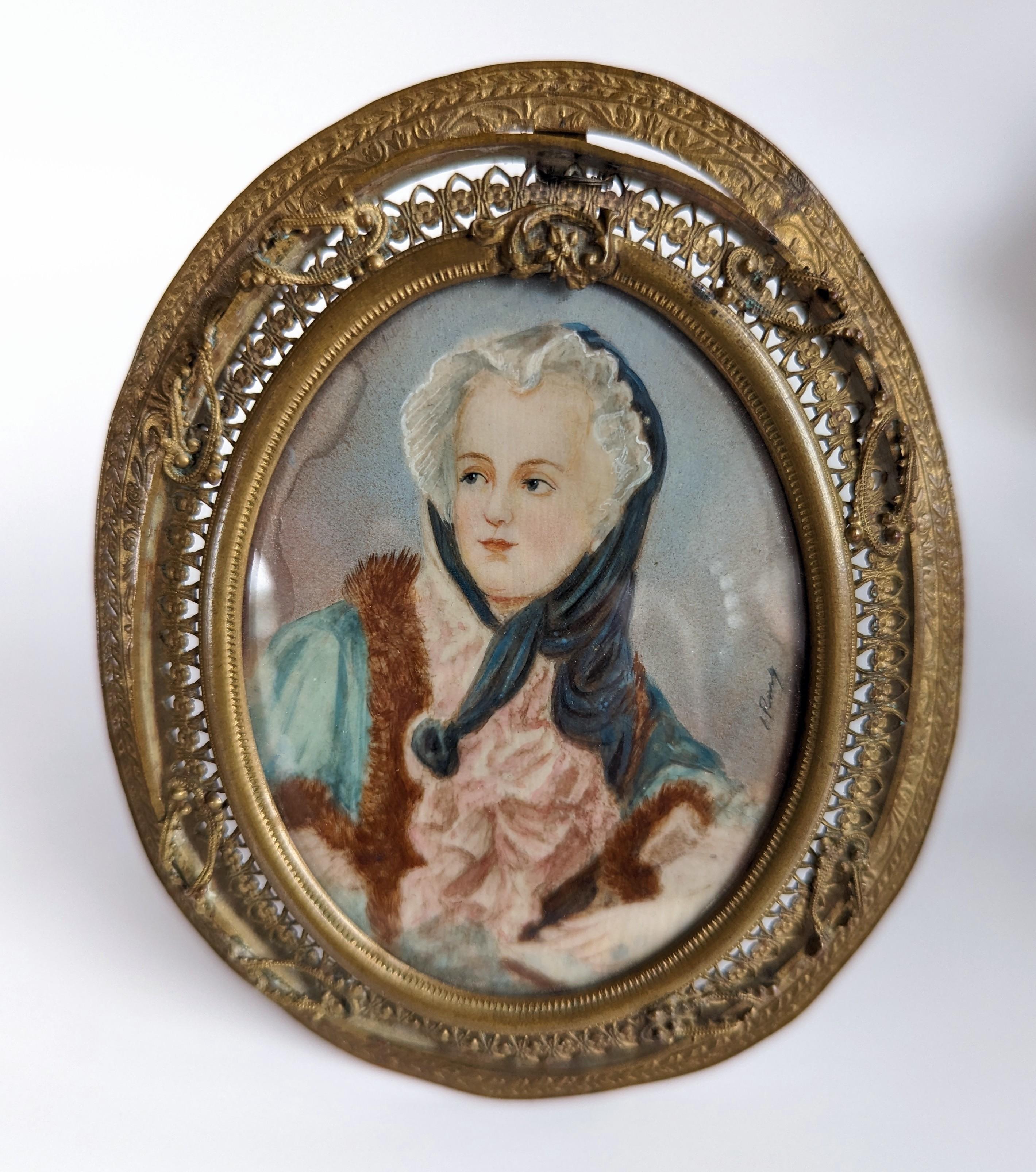 Stunning antique hand painted miniature portrait in filigree brass frame with easel back. Signed by the artisan on the corner of the painting as shown in the second to last photograph (unfortunately we are unsure who the artist is). Measures