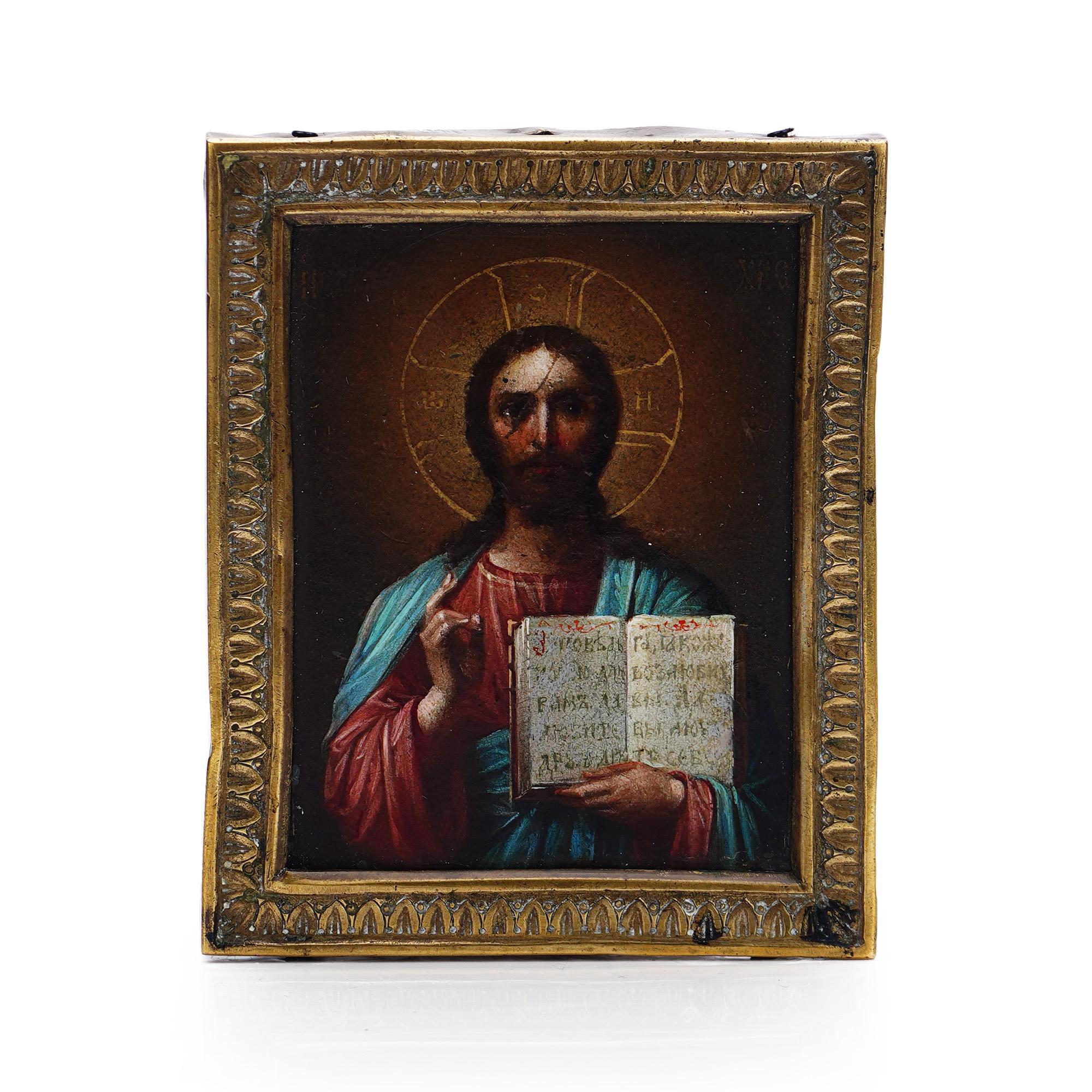 Antique hand-painted oil on panel orthodox icon of Jesus blessing and holding the bible, mounted in brass. 
Dimensions: 8 x 6.5 x 1.1 cm
Weight: 60.61 cm 


In Greek and Byzantine Christian art, as well as in most Eastern traditions, Christ is