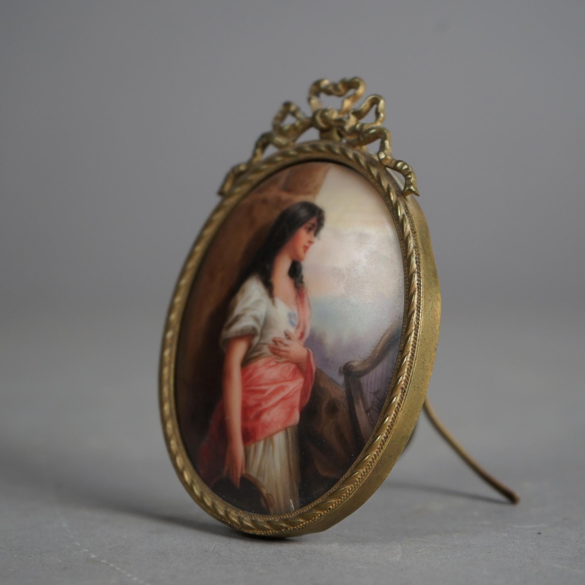 Cast Antique Hand Painted Porcelain Plaque of a Young Woman In Oval Brass Frame 19thC For Sale