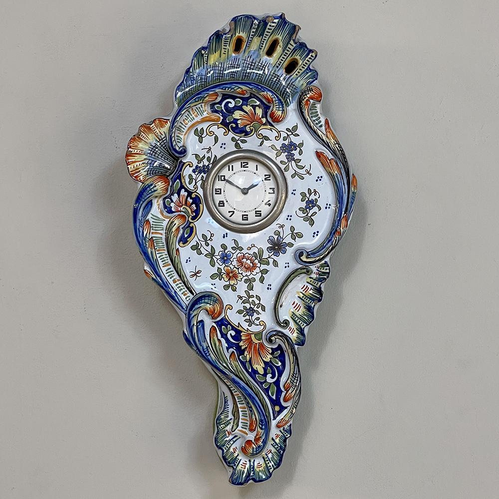 Antique Hand-Painted Faience Wall Clock from Rouen is a charming decorative item, hand-painted in natural earth tones yet with a vibrant combination of colors that will brighten any room!  Cast in porcelain then hand-painted to accentuate the