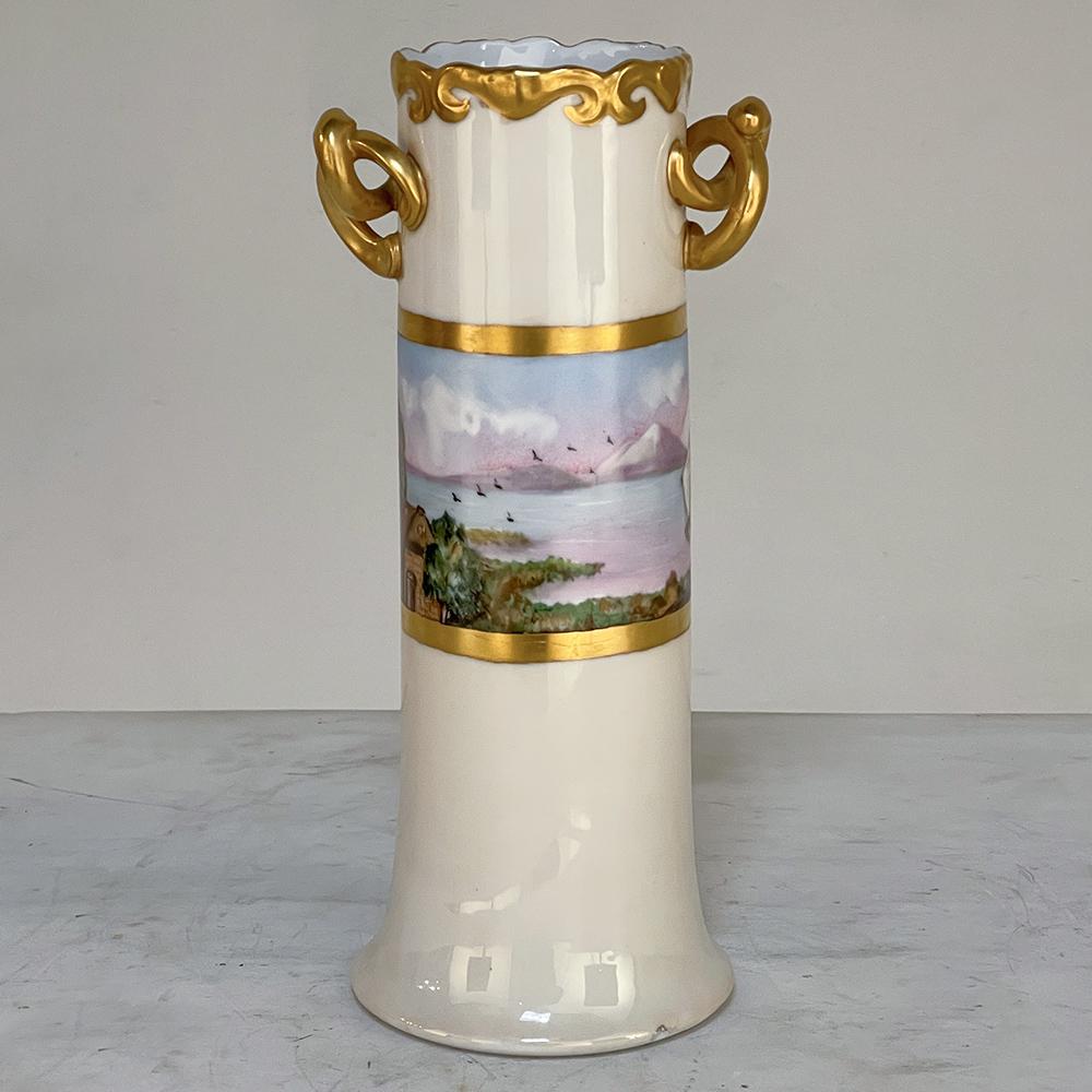 Antique hand-painted vase from Bavaria is a wonderful example of the fine porcelains produced by the southern region of today's Germany. The elaborately formed handles contrast with the tailored design of the remainder of the piece, which features