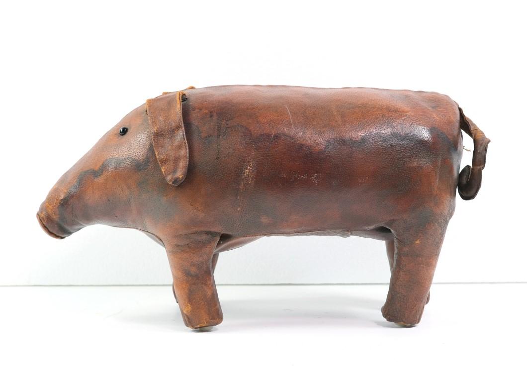 This little piggy pig is at market! Early 20th Century antique hand sewn leather. This baby hog has sparkling black glass eyes. This can be seen at our 400 Gilligan St location in Scranton, PA.