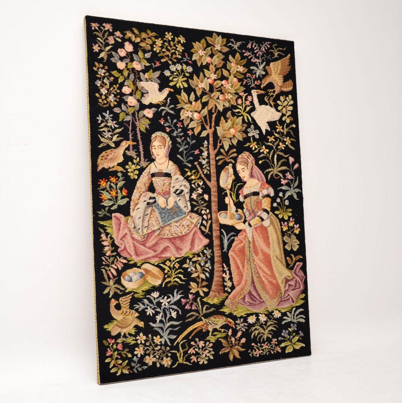 Large antique hand stitched needlepoint tapestry with a colourful scene in very good original condition and dating to circa 1890-1910 period. The scene depicts two ladies surrounded by many different birds, foliage, trees & flowers. Please enlarge