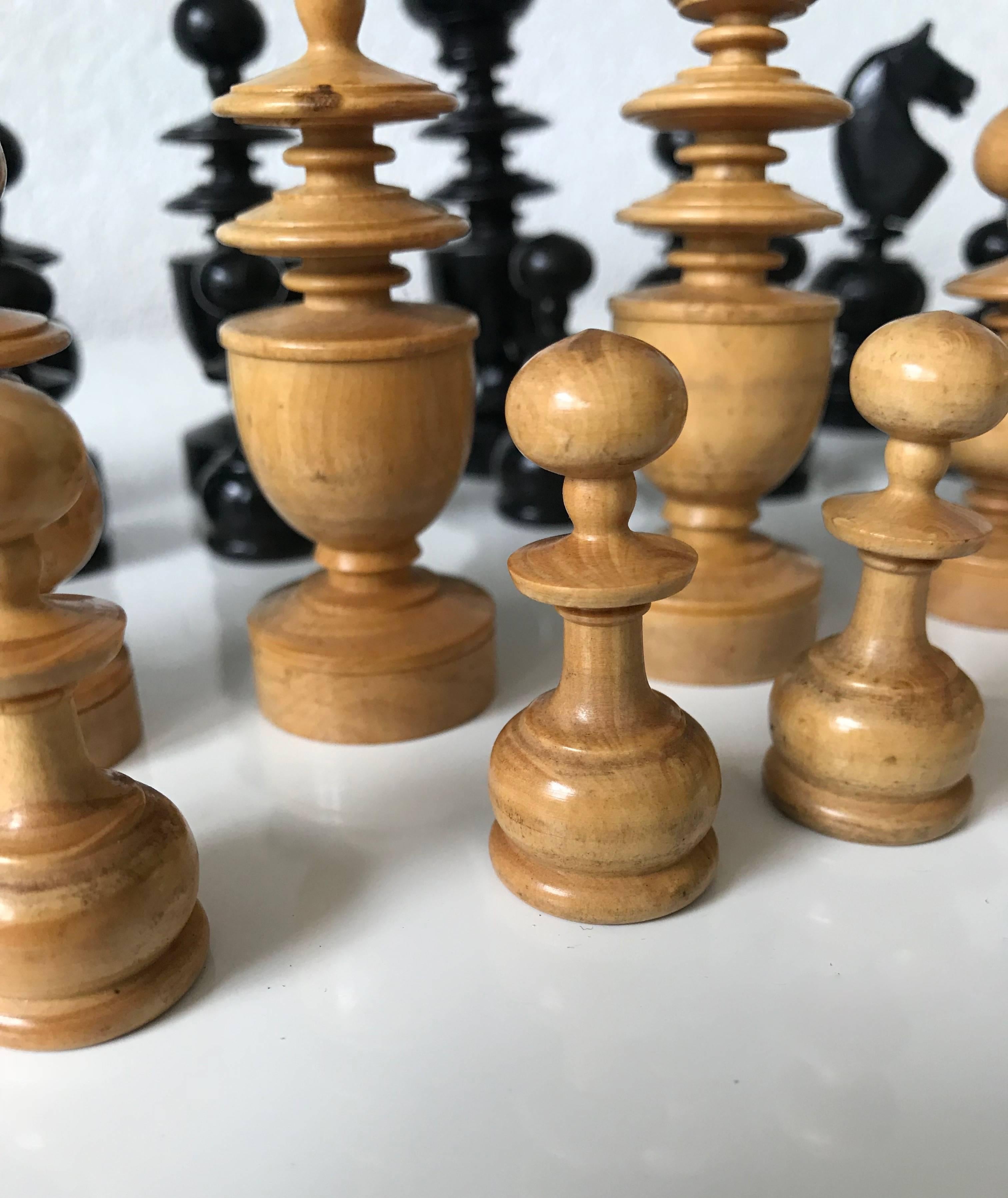 Good size, complete and stylish chess pieces. 

For the lovers of the game of chess we present these handcrafted pieces from the early 20th century. The classical manner in which these pieces are designed and executed is a joy to look at. The size