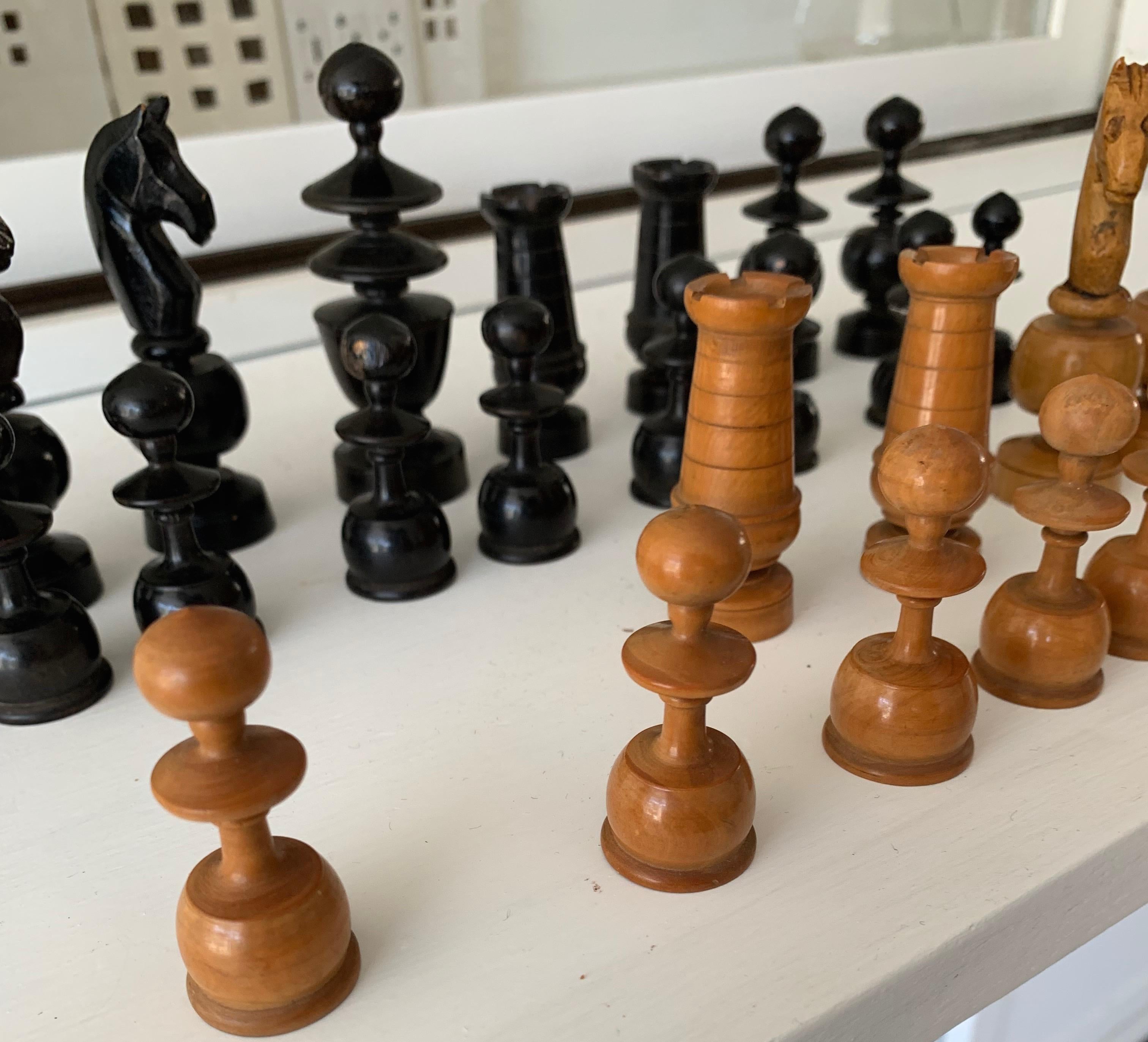 Good size and stylish set of chess pieces. 

For the lovers of the game of chess we present these handcrafted pieces from the early 20th century. The classical manner in which these pieces are designed and the workmanship with which they are