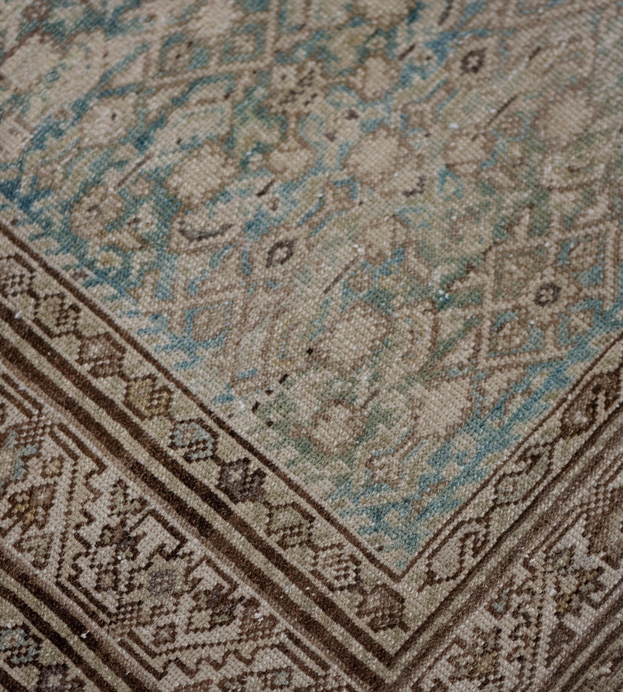 This antique Persian Malayer runner has a shaded light blue field with an overall ivory and mole-brown herati-pattern, in an ivory border of mole-brown serrated leaf and palmette vine between sandy-yellow boteh vine stripes, plain outer chocolate