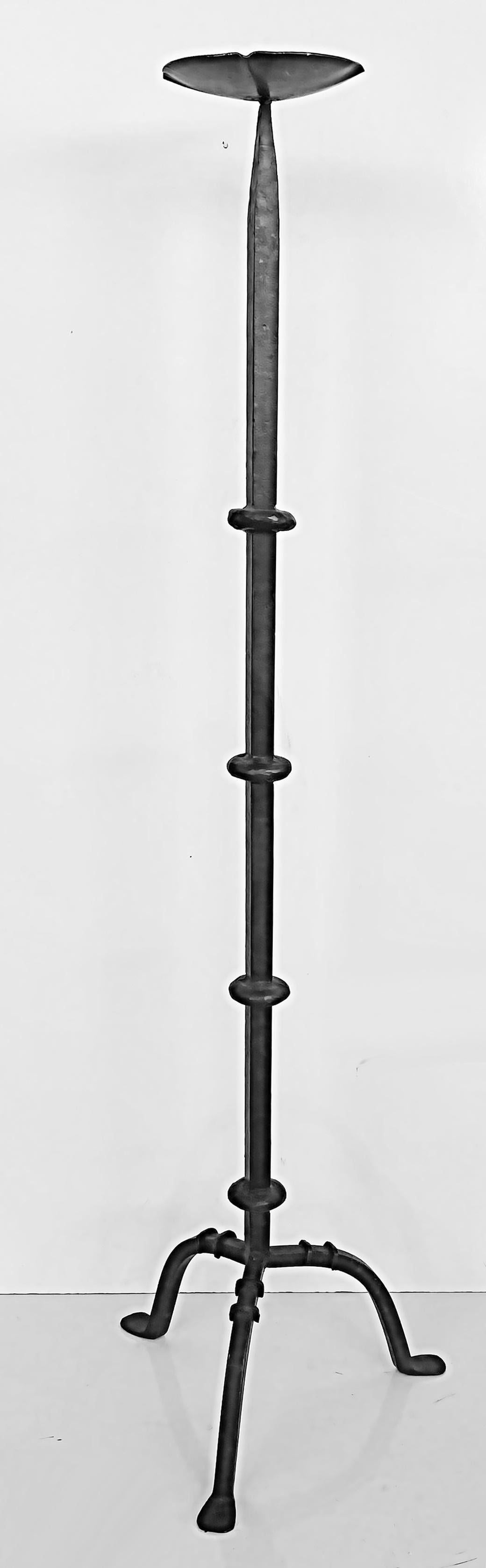 Antique hand-wrought Iron candle stands from a Millbrook, NY Estate

Offered for sale is a set of 2 antique 19th-century hand-forged wrought iron candle sticks. They were acquired from a Millbrook, New York estate. They are a matching set with one