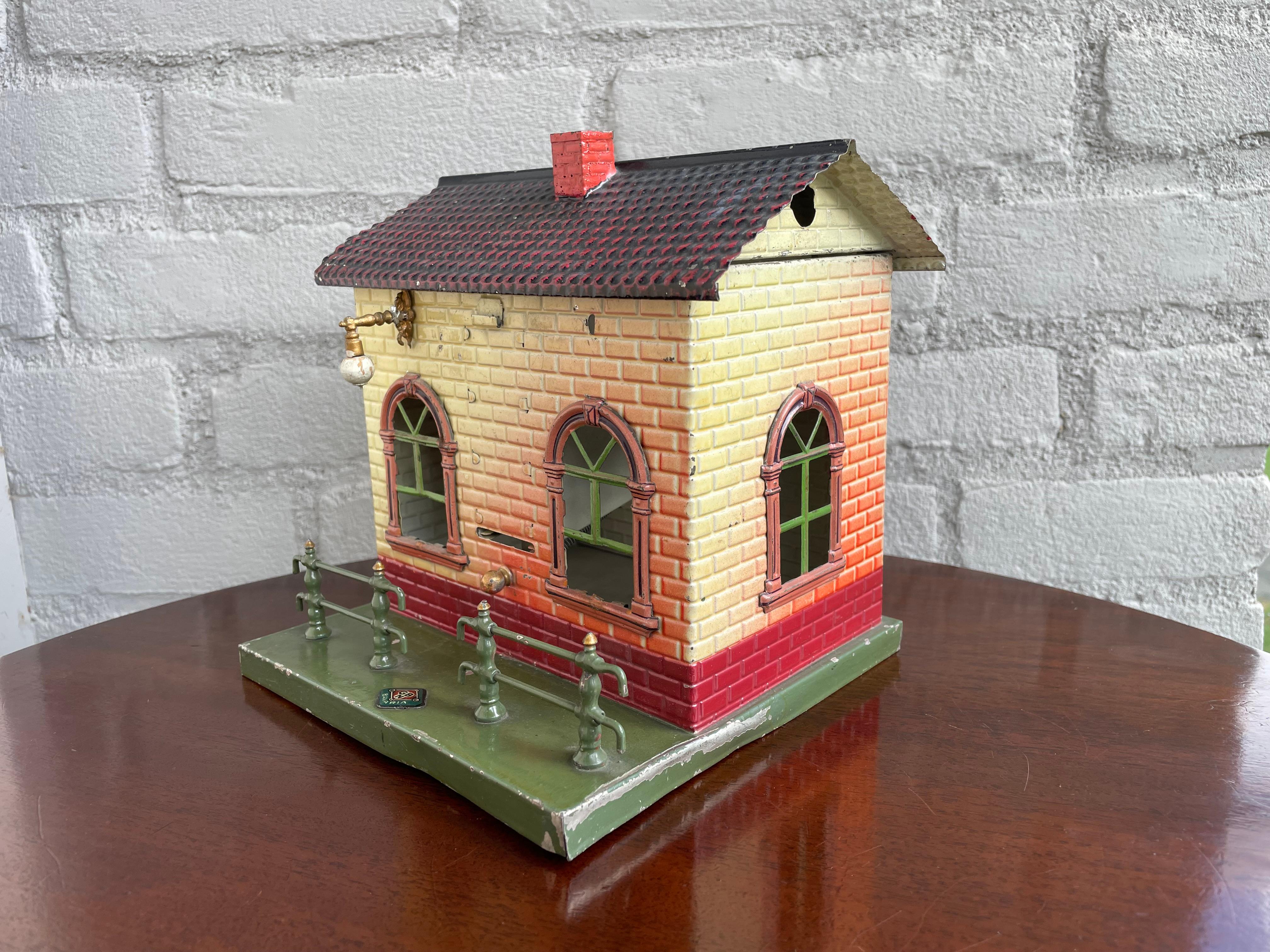 Very rare and great looking antique toy train ticket dispenser by Gebruder Bing, Nurnberg (GBN).

Since buying and selling only the rarest antiques has become part of our goal(s) in life, we did not hesitate one second when we were given the