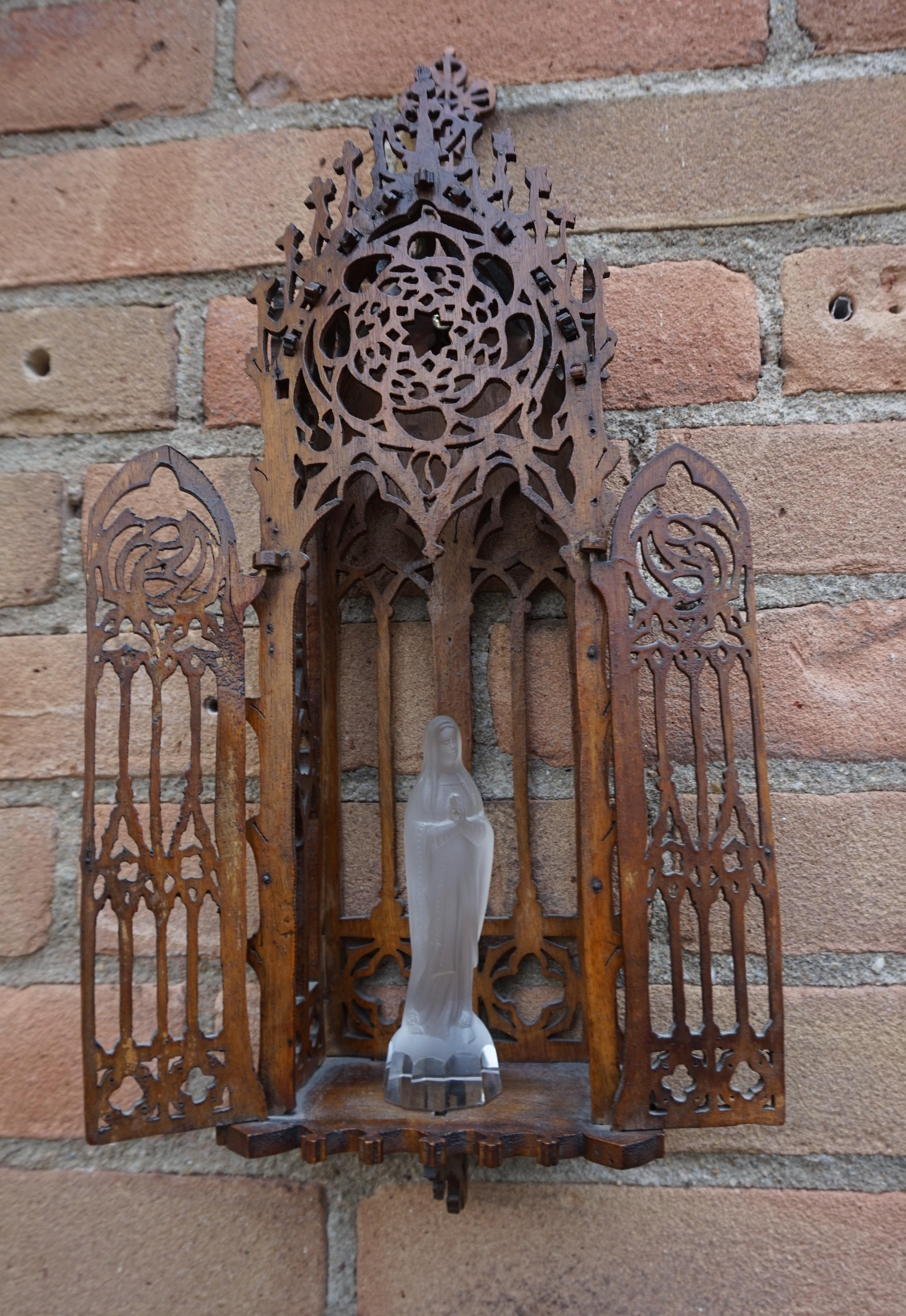 Rare Gothic-art shrine with Mother Mary sculpture.

This handsome and decorative, Gothic wall shrine is completely hand-crafted out of solid oak and it will look awesome, no matter where you decide to mount her. It must have taken its creator quite