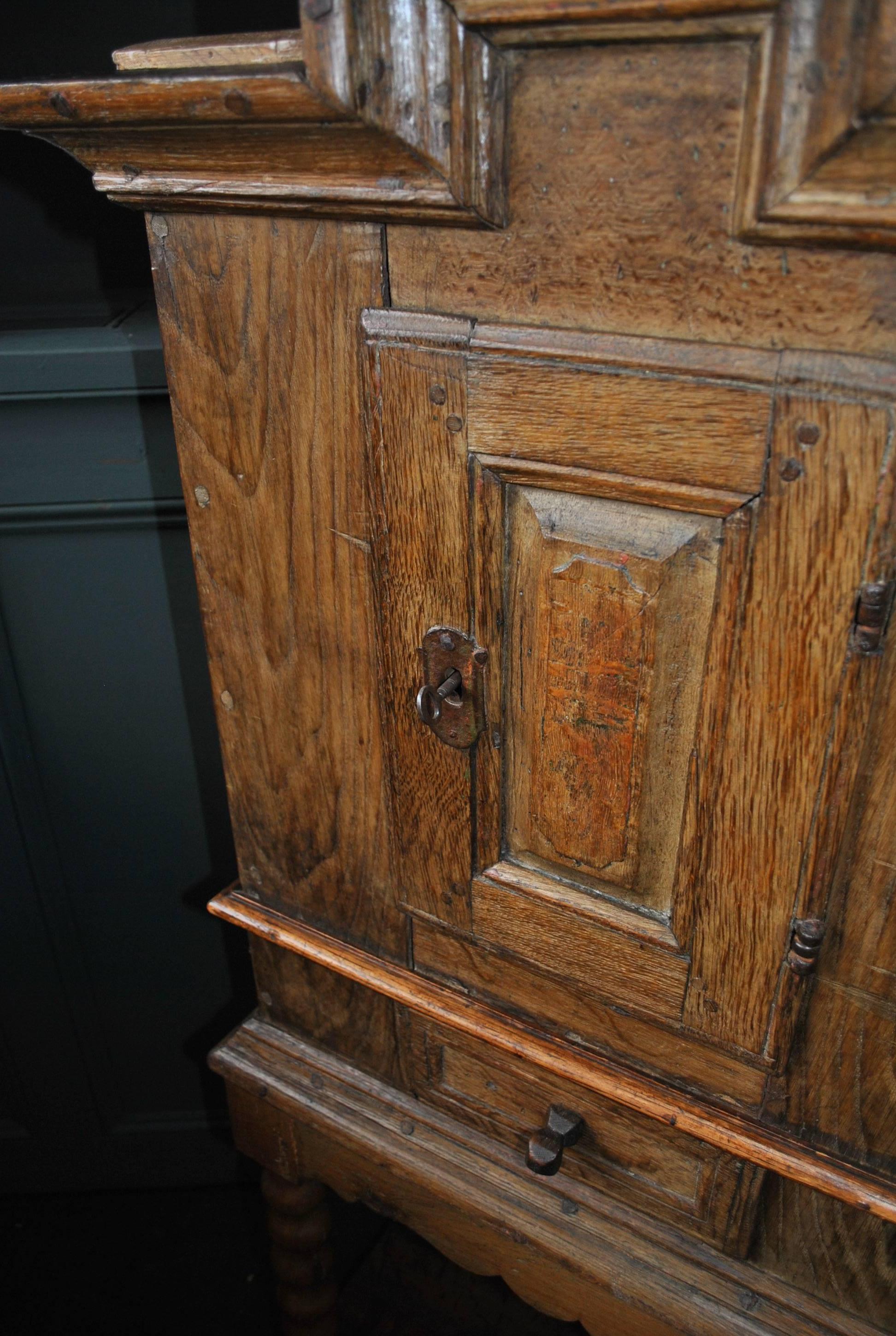 A charming rustic handcrafted antique Gustavian cabinet. Made from solid European oak this piece is absolutely full of naive country character. Dating from the late 18th century, Scandinavia. Wonderful hand forged metal fittings - hinges, escutcheon