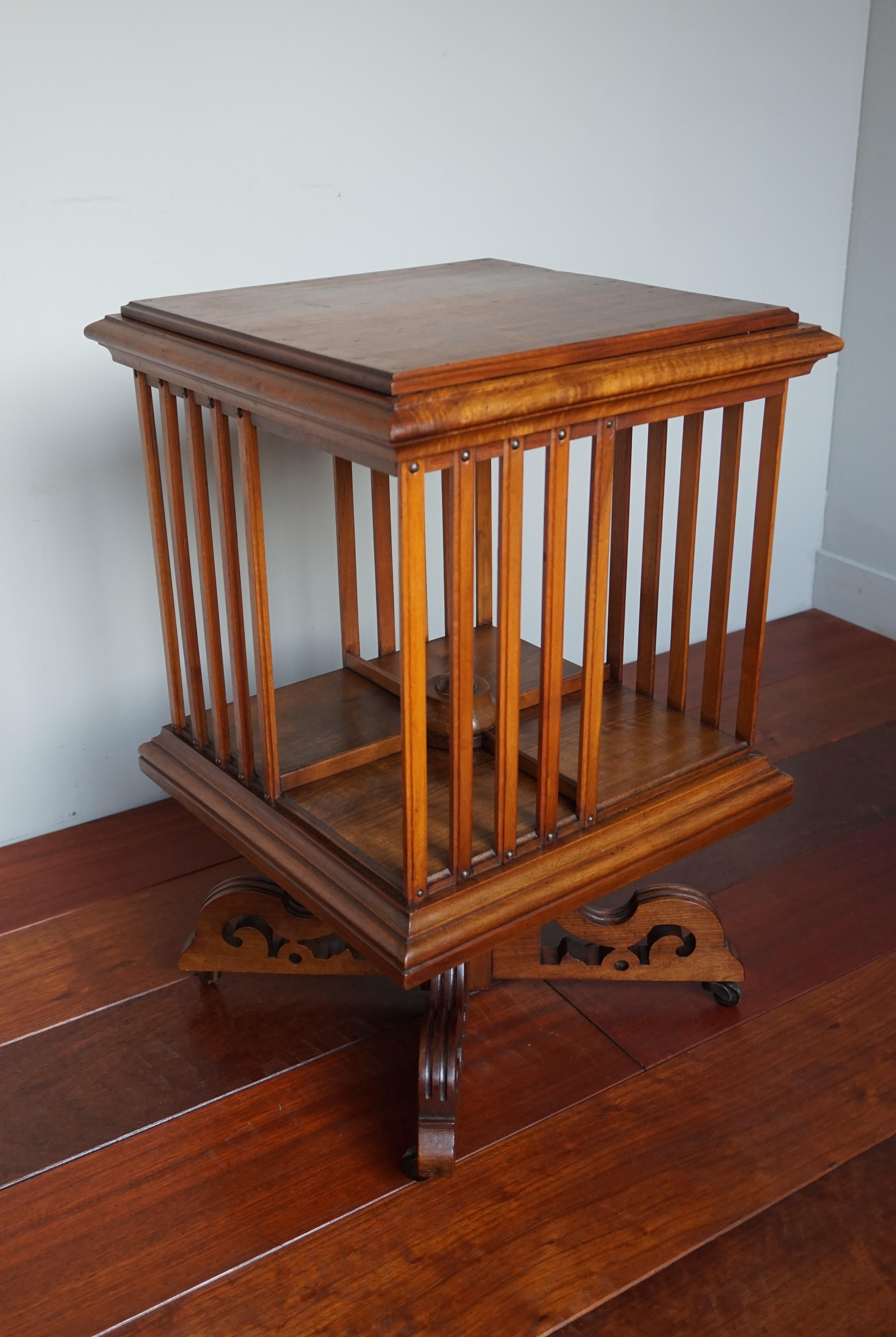 Arts and Crafts Antique Handcrafted Nutwood Revolving Bookcase w. Original Brass & Wooden Wheels