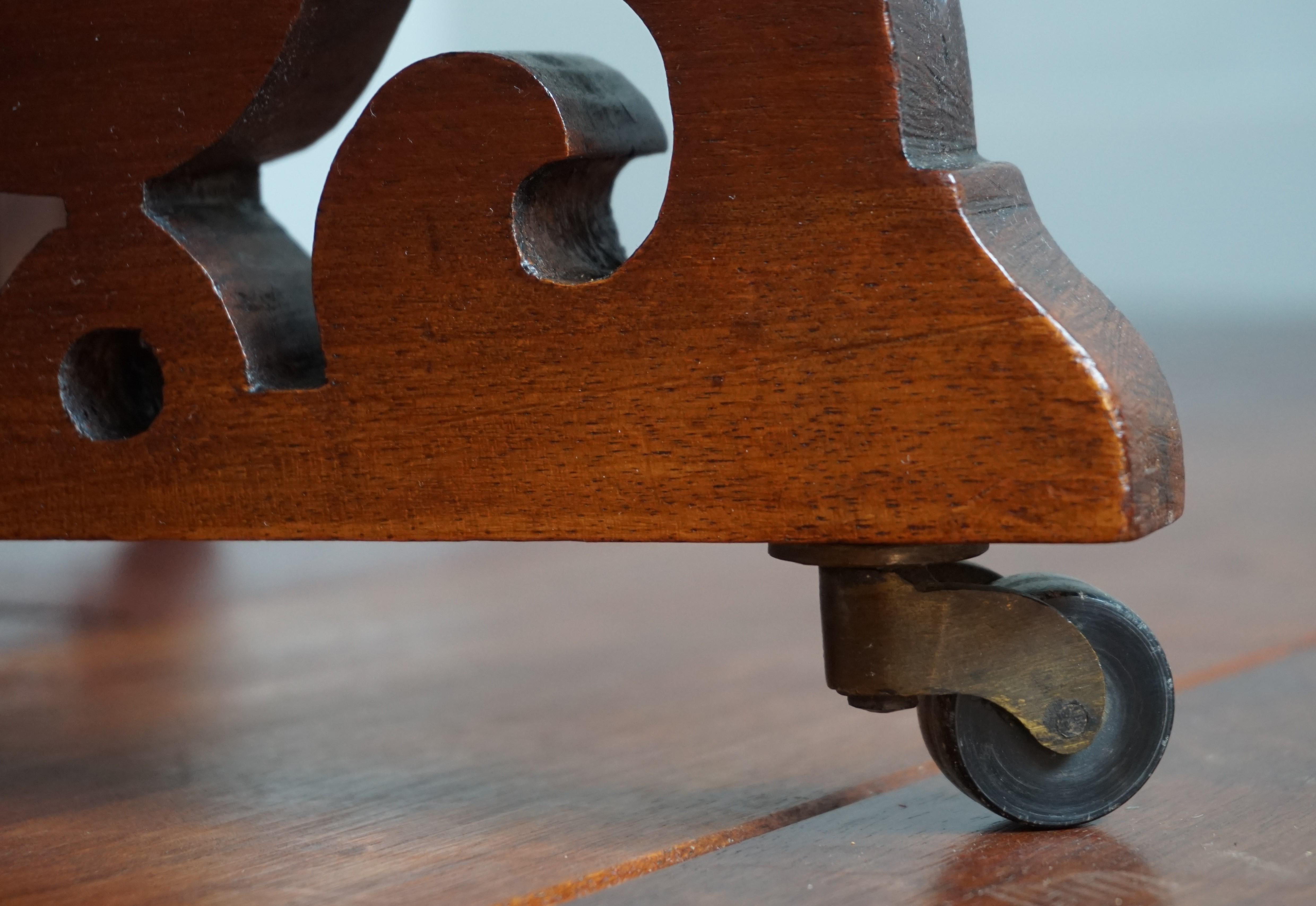 Hand-Crafted Antique Handcrafted Nutwood Revolving Bookcase w. Original Brass & Wooden Wheels