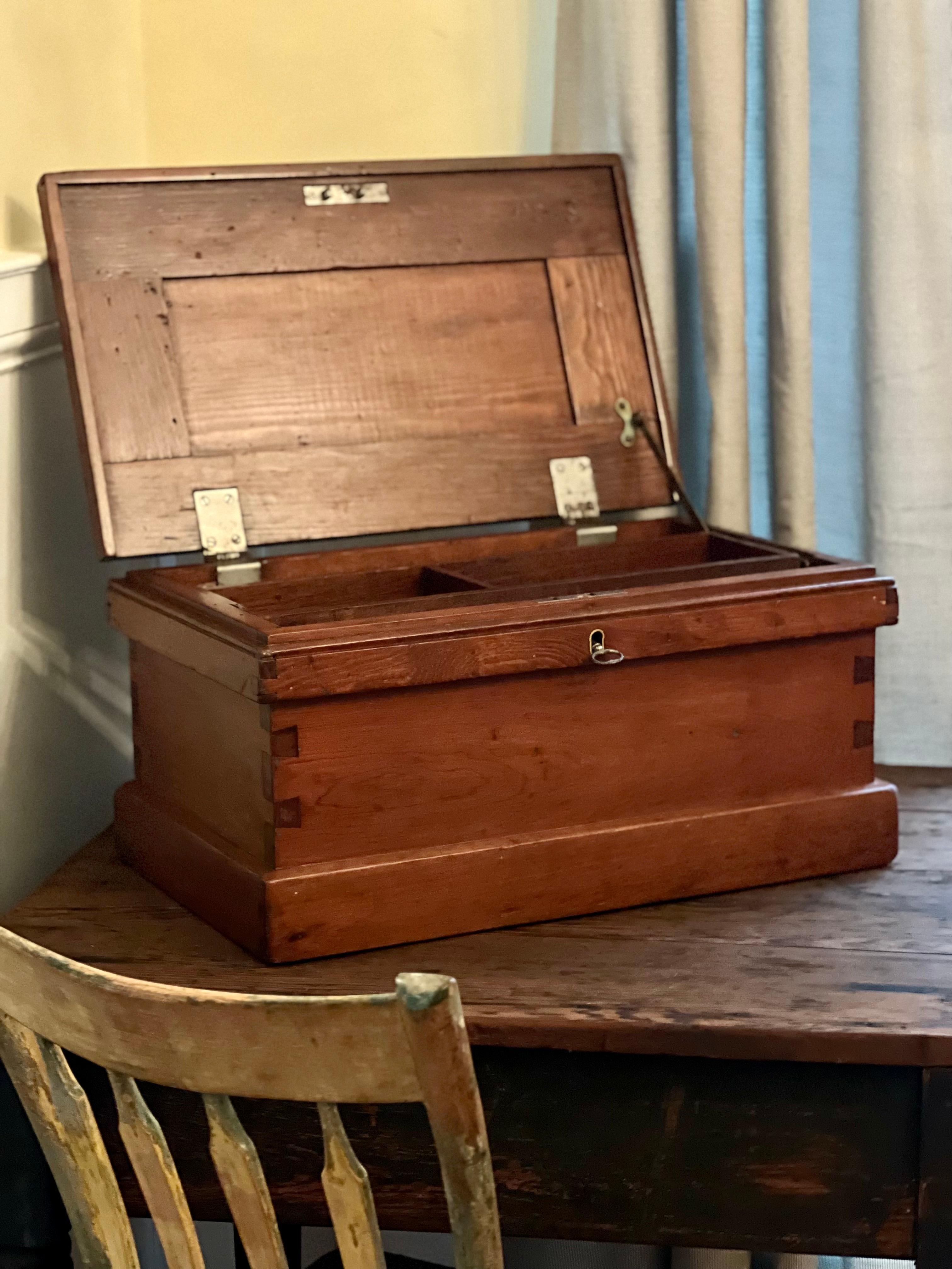Antique small merchant's chest or box, c. 1920's.

Wonderful petite chest handcrafted of teak and beautifully carved with dovetail joint construction. The divided, sliding tray is removable and offers convenient organization options. The original