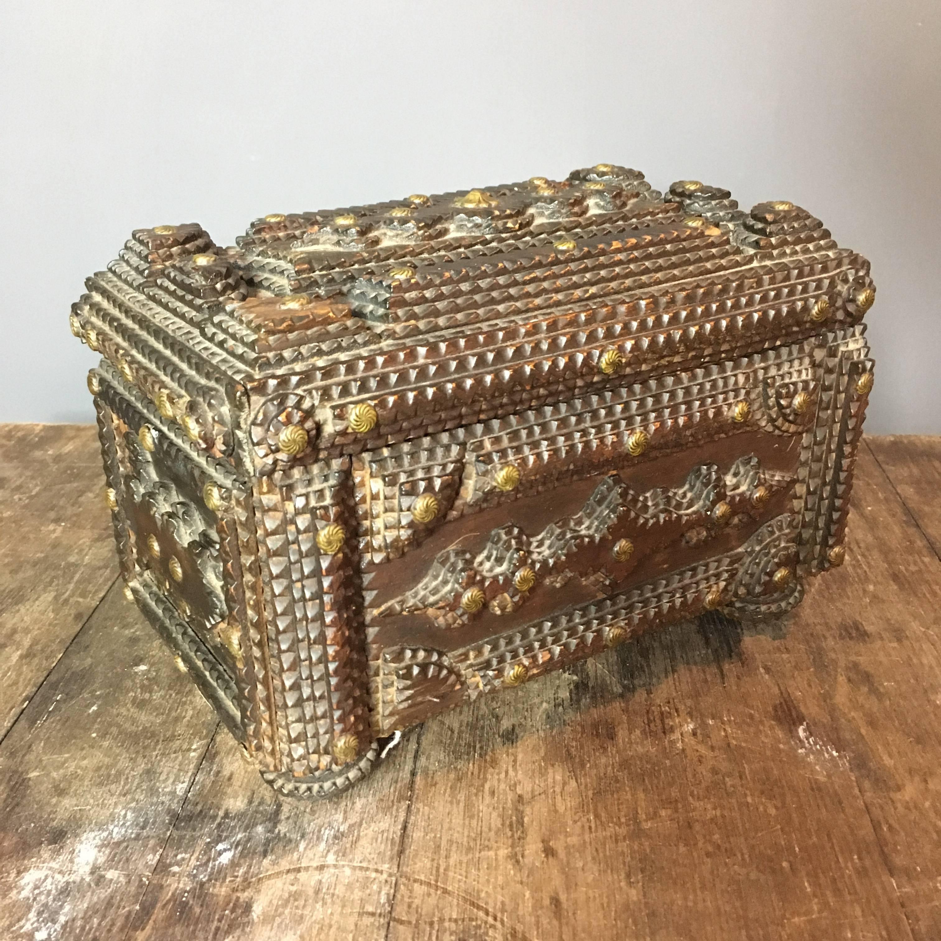 Fantastic example of a Tramp Art keepsake box

The box has been carved beautifully and detailed with small brass decorative studs

Inside the box lid is an original photograph, this could be the maker or family members, we don't know but it was