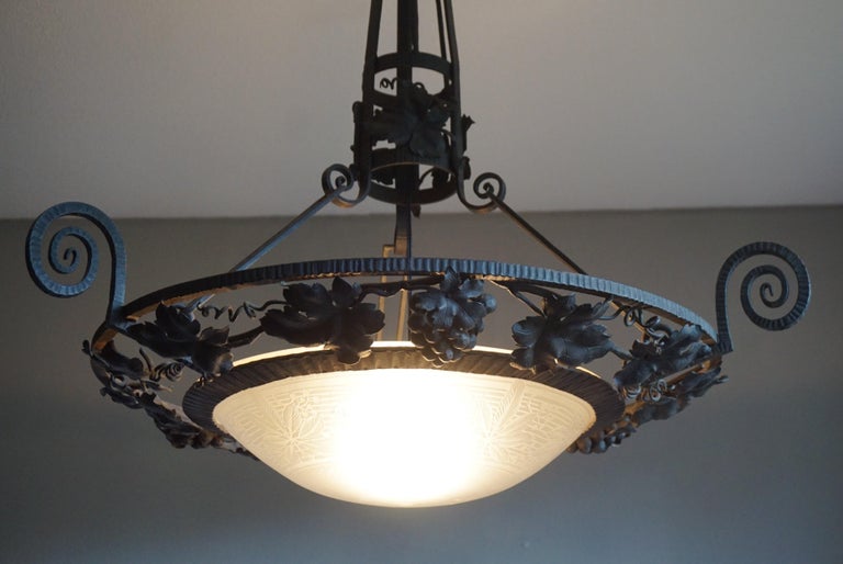 Stunning and sizeable French light fixture.

Some antiques are just that extra bit more impressive and when we found this French pendant from the Arts & Crafts era, we immediately felt that this is one of those antiques. A highly skilled blacksmith
