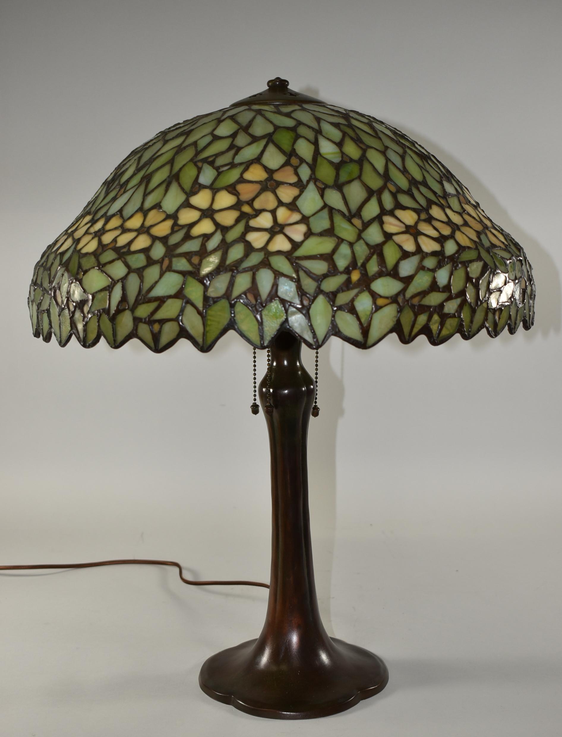 Antique Handel Arts & Crafts leaded table lamp with three Hubbell sockets acorn pull chains. Shade is 18