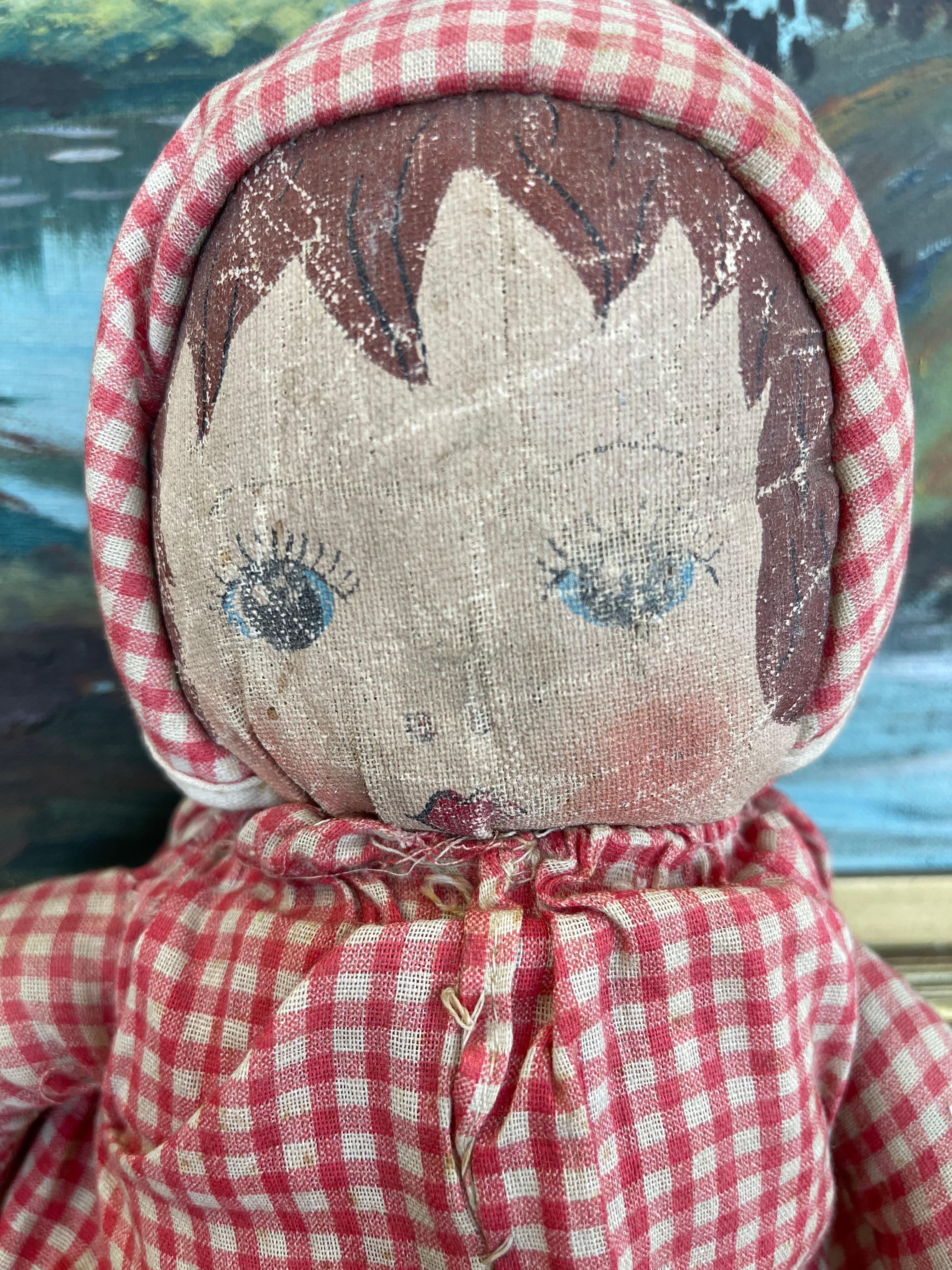 Antique Handmade Cloth Doll with Painted Face and Red Gingham Outfit For Sale 1