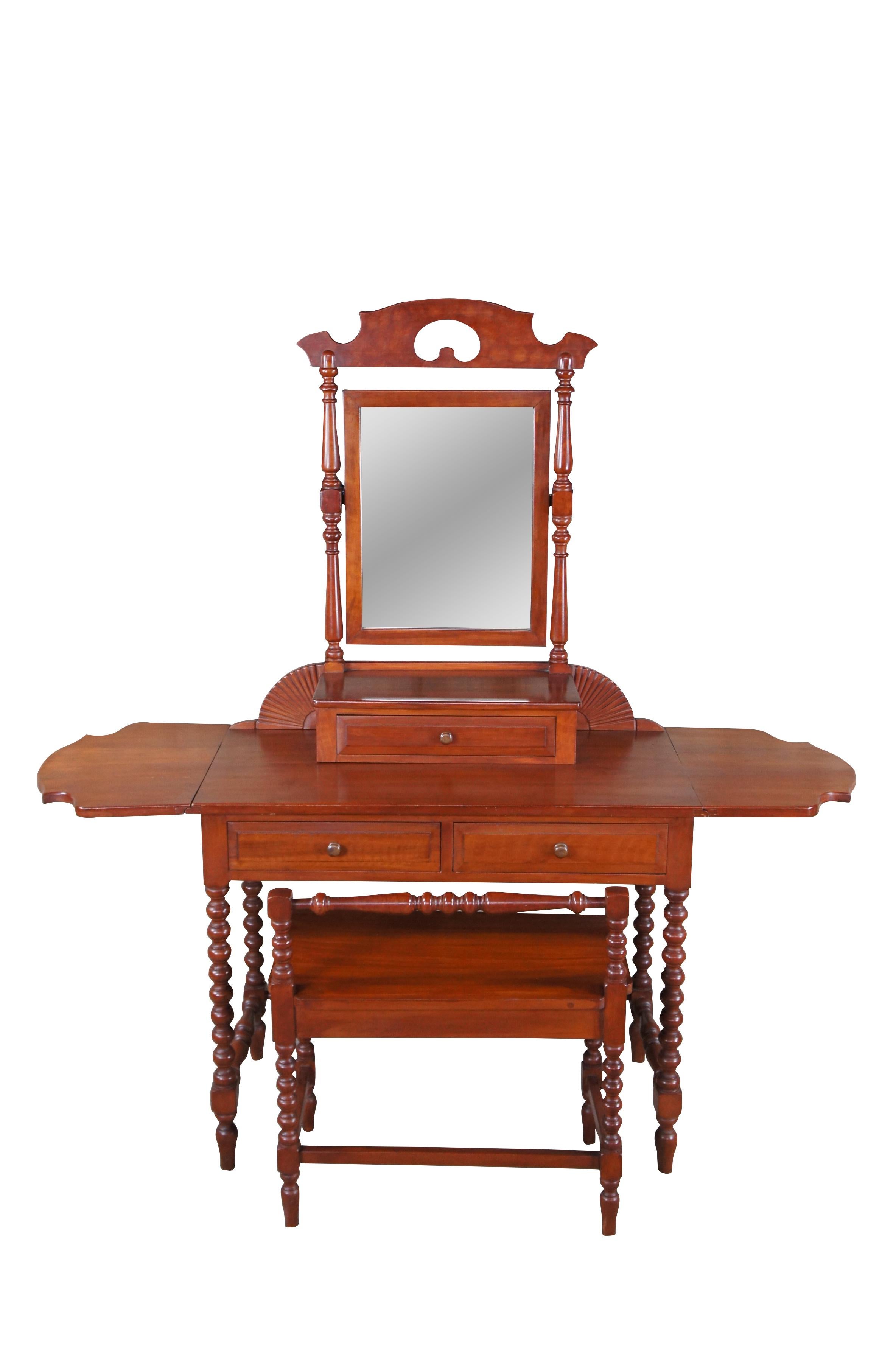Antique early American dressing table vanity and bench. Made of cherry featuring unique form with serpentine drop leaves, adjustable mirror, multiple drawers and carved, ribbed and turned accents

Made by William P Hund of Perrysburg Ohio in 1932,