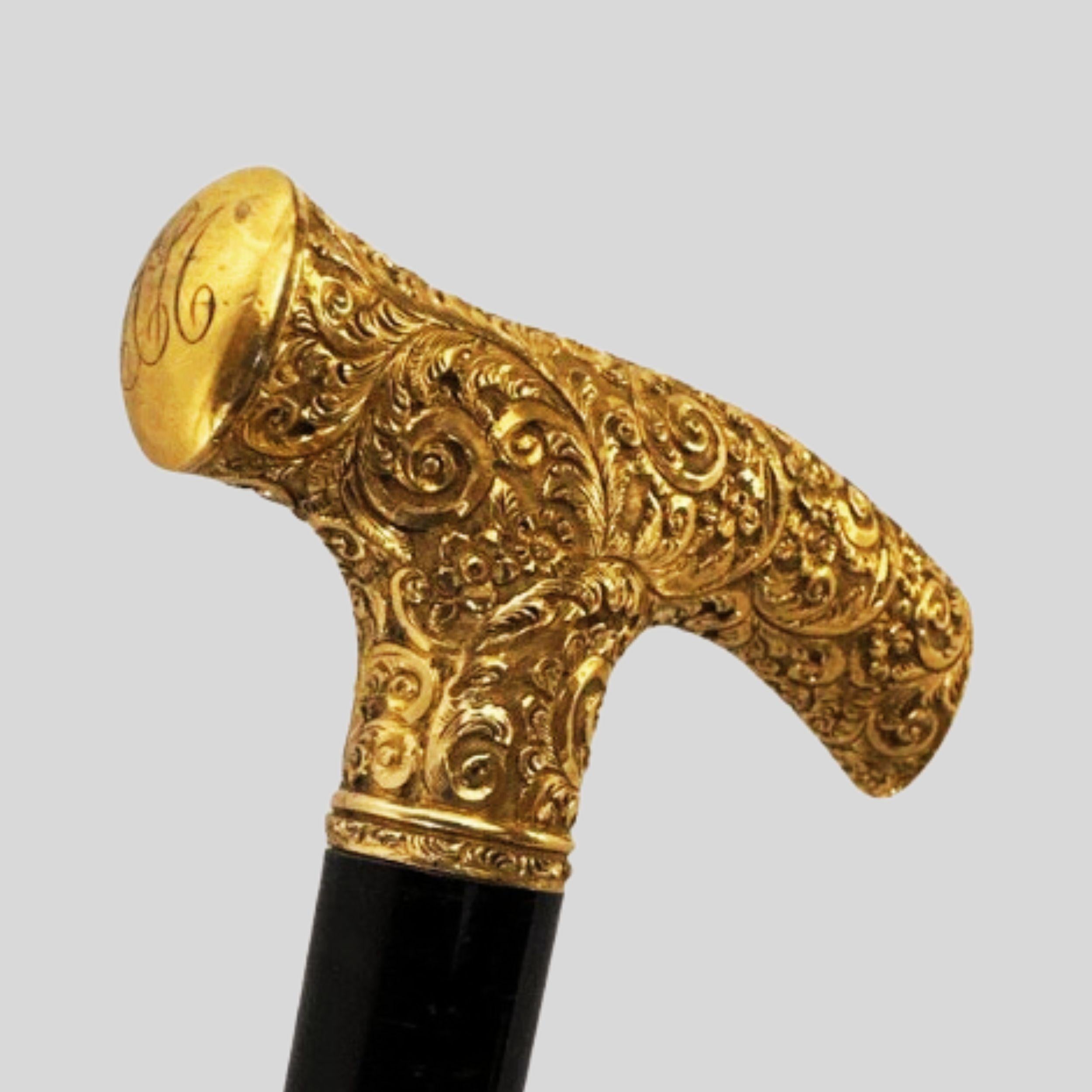 Antique Handmade Gold Plated Derby Handle Walking Stick Black Wood (Possible Gold)

This beautiful piece is not only a dynamic example of a derby-style handled cane / walking stick, but also of the high level of craftsmanship associated with this