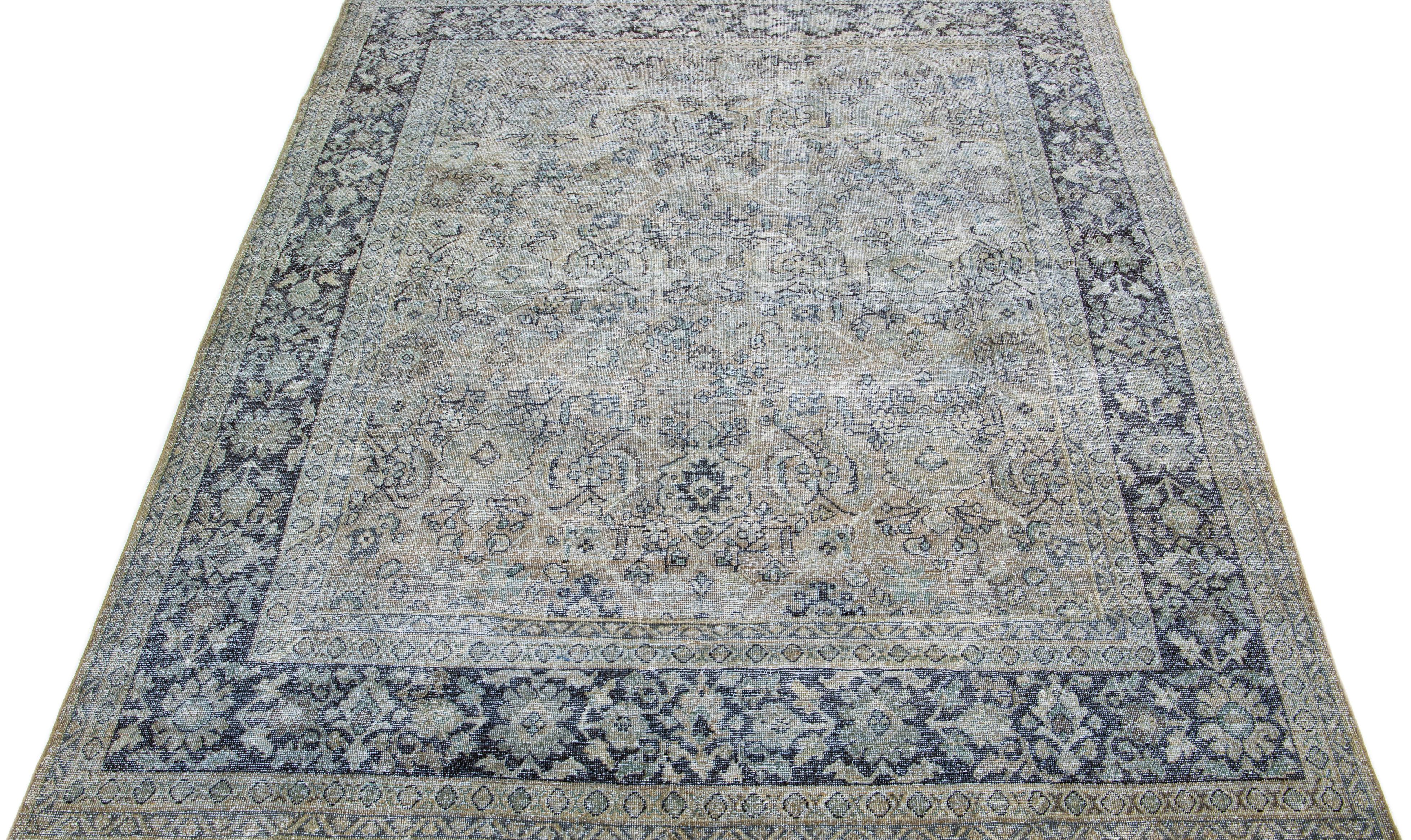 Beautiful antique Tabriz hand-knotted wool rug with a grey color field. This Persian rug has a blue frame and accents in a gorgeous all-over floral design.

This rug measures: 7'10