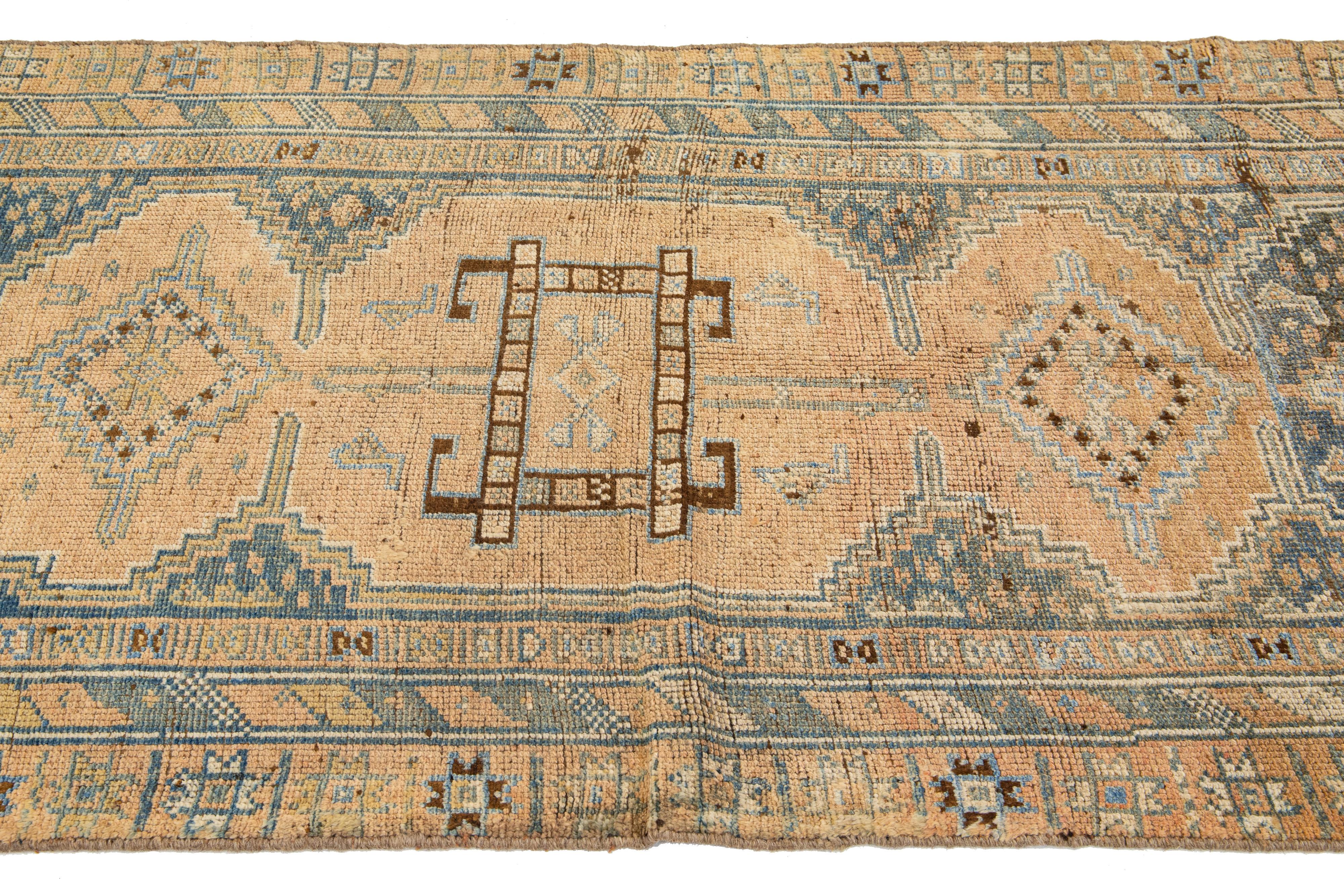 Persian Antique Handmade Heriz Tan Wool Runner with Tribal Design For Sale