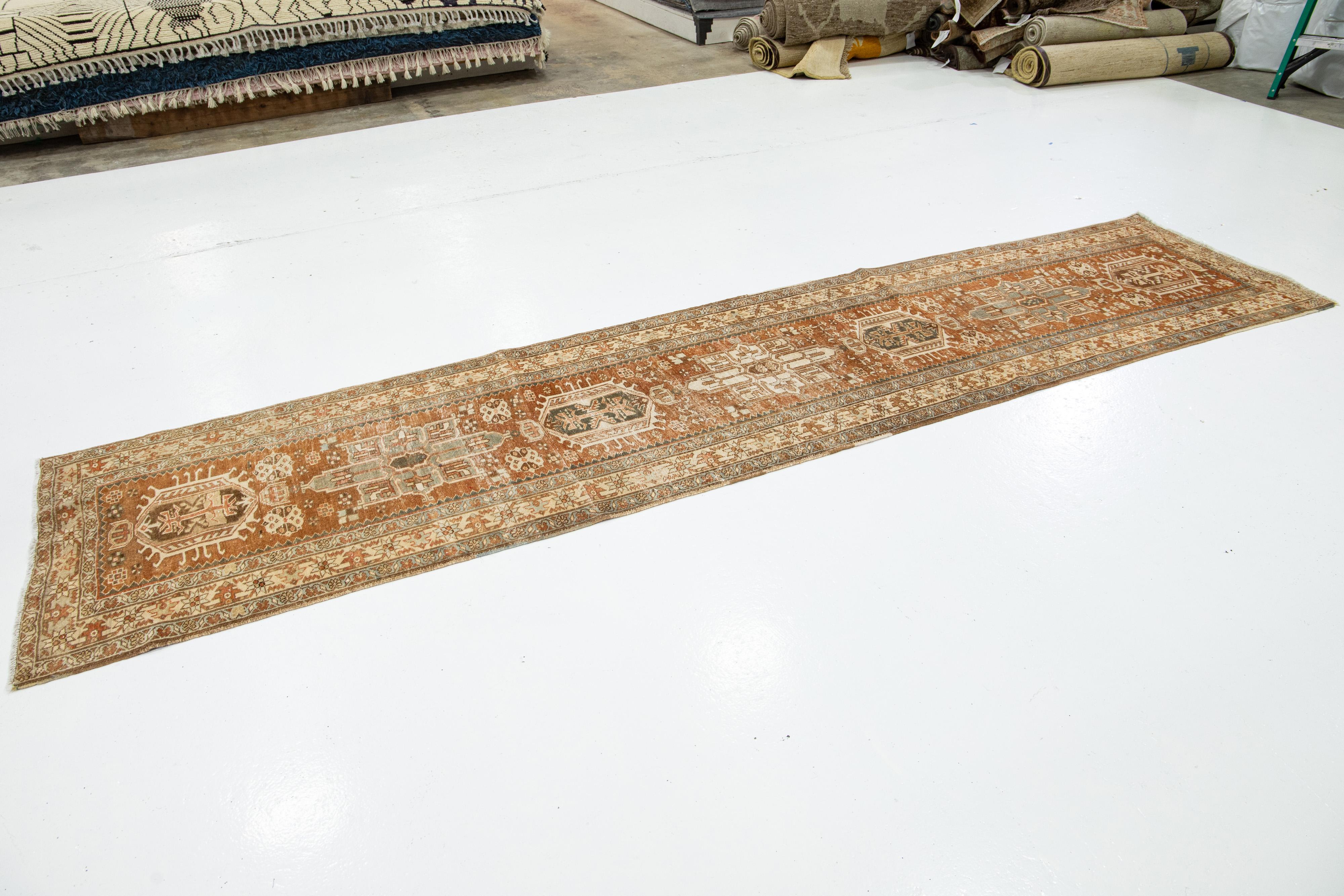 Hand-Knotted Antique Handmade Heriz Wool Runner In Orange With Tribal Design For Sale