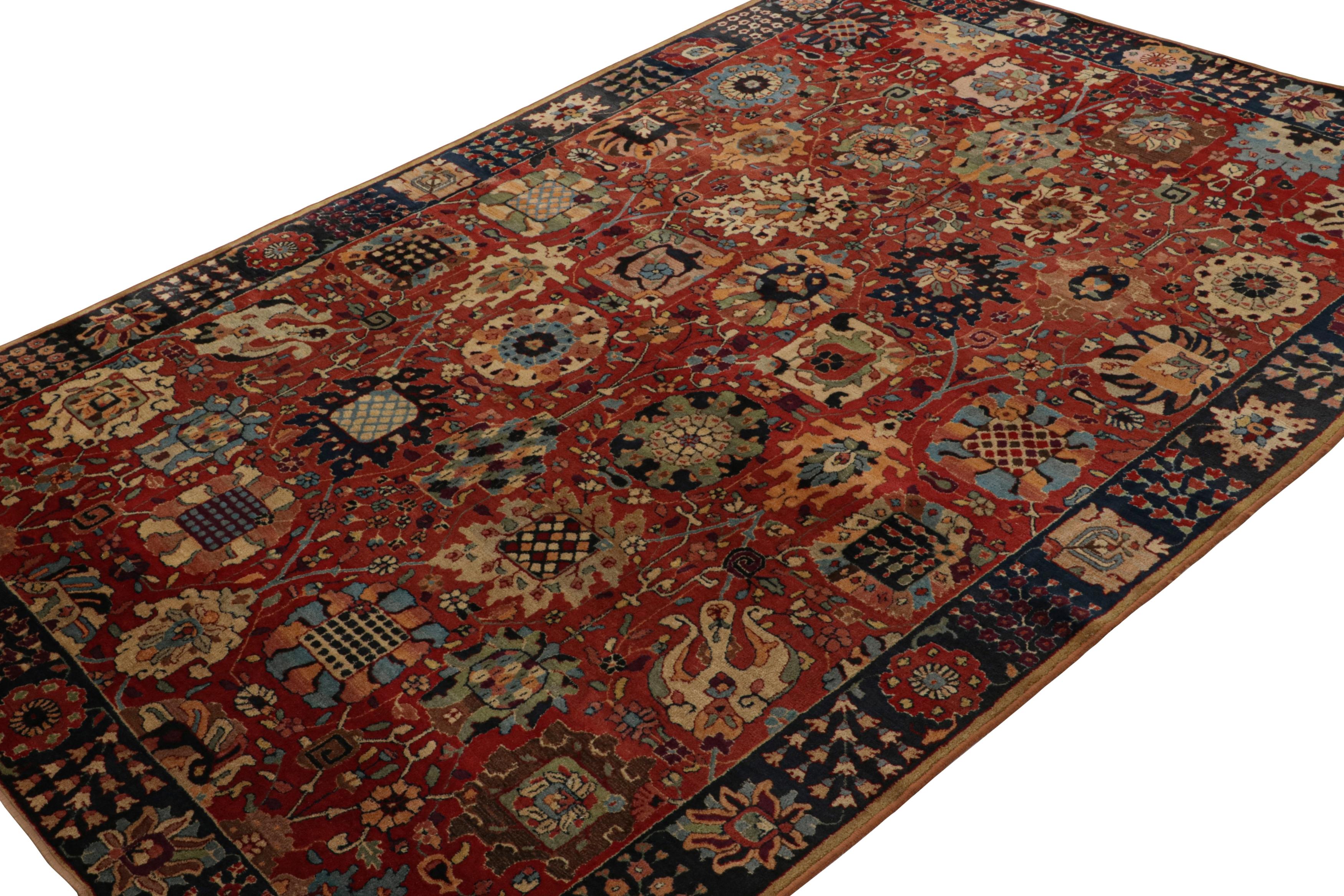 This 6x10 antique hooked rug is believed to be a rare Tetex rug—a curation from the Rug & Kilim Collection. Handmade with wool and originating from Germany circa 1920-1930, its design enjoys beige-brown and navy blue floral patterns on a red