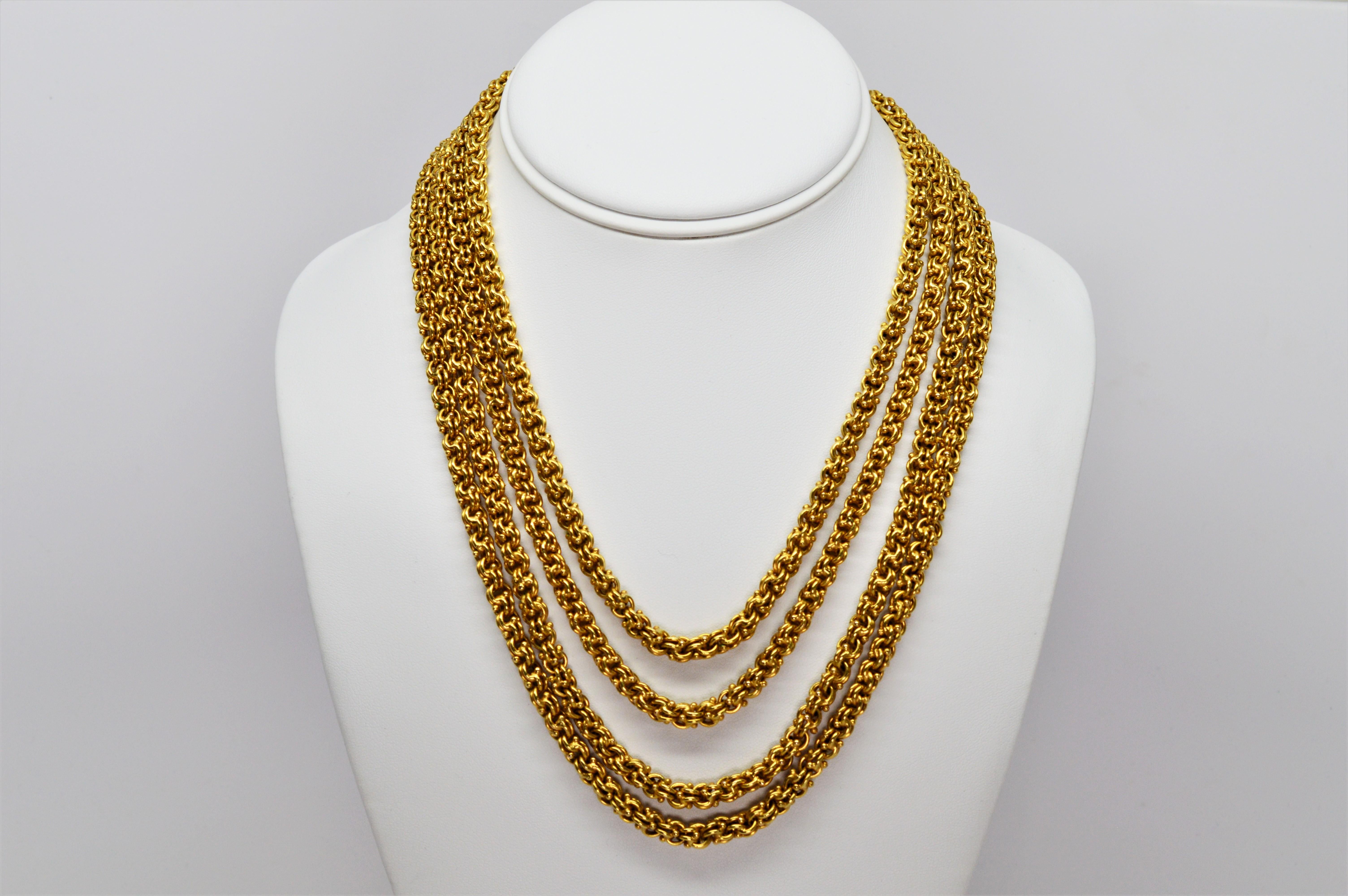 Truly extraordinary describes the remarkable yards of fourteen karat 14K yellow gold that creates this antique double cable chain necklace.
Measuring seventy eight (78) inches long, this continuous length of handmade chain, at 5.3 mm in heft, is