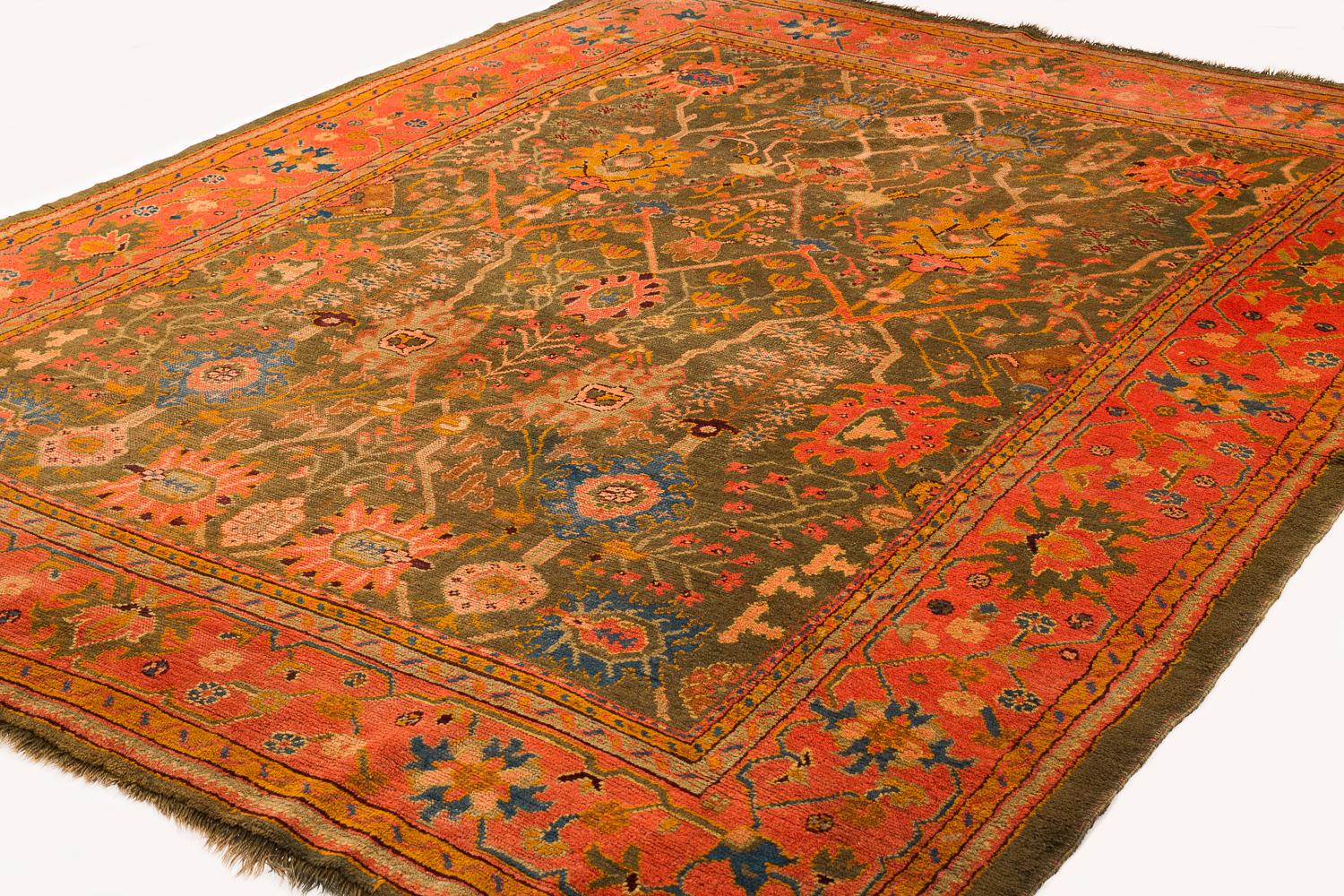 This antique Ouskak is an exceptional piece. This type of Oushak is very desirable based on the design and colors. The colors are really incredible jewel tones, the colors in this rug are rare for this type of Oushak. For its age, this rug is in