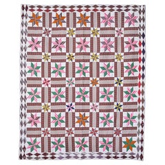 Courtepointe patchwork ancienne faite à la main « Lemoyne Stars » en multicolores, États-Unis, années 1870