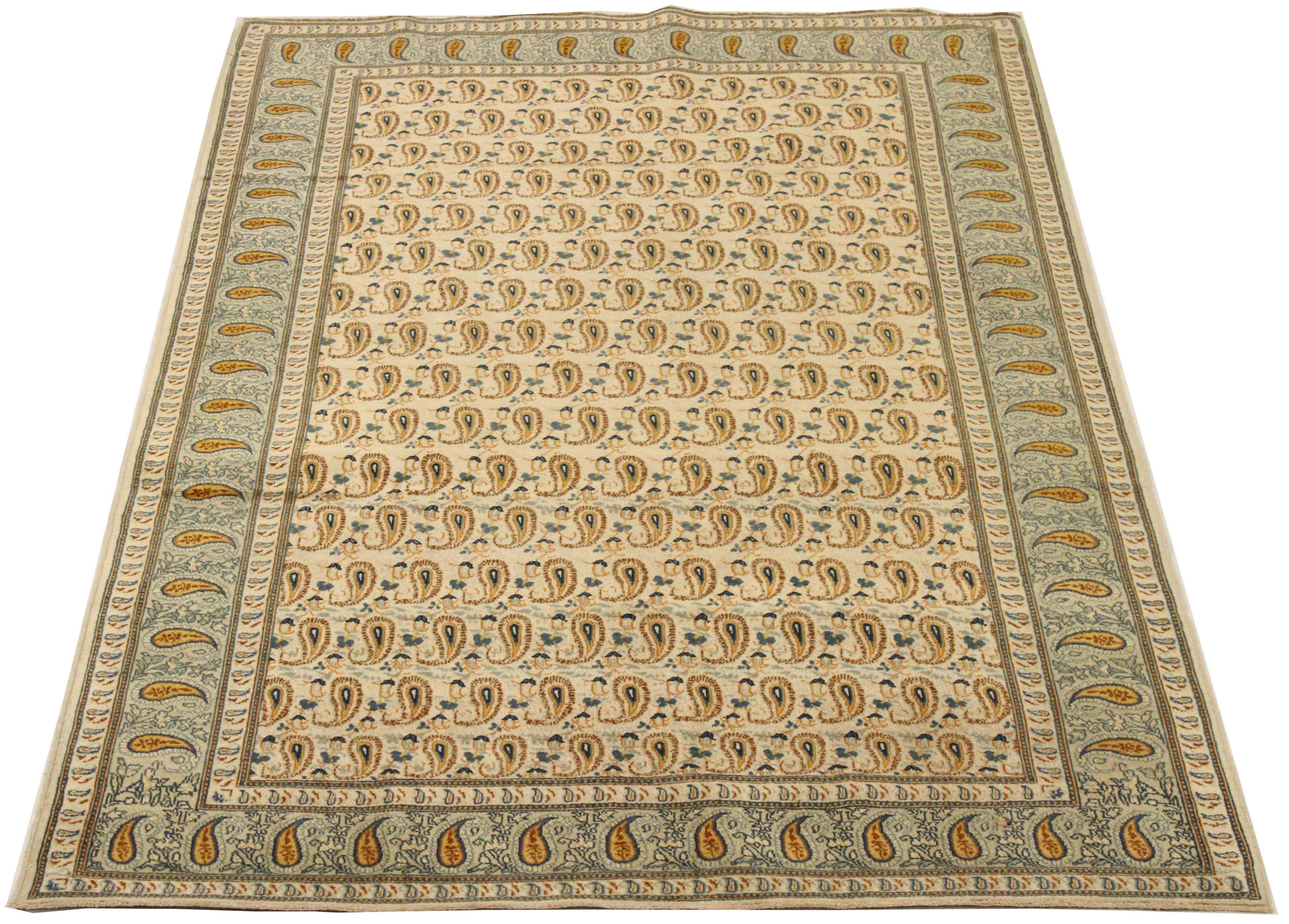 Antique mid-20th century hand-woven Persian area rug made from fine wool and all-natural vegetable dyes that are safe for people and pets. It features traditional Kashan weaving depicting intricate floral and botanical patterns often in bold colors.