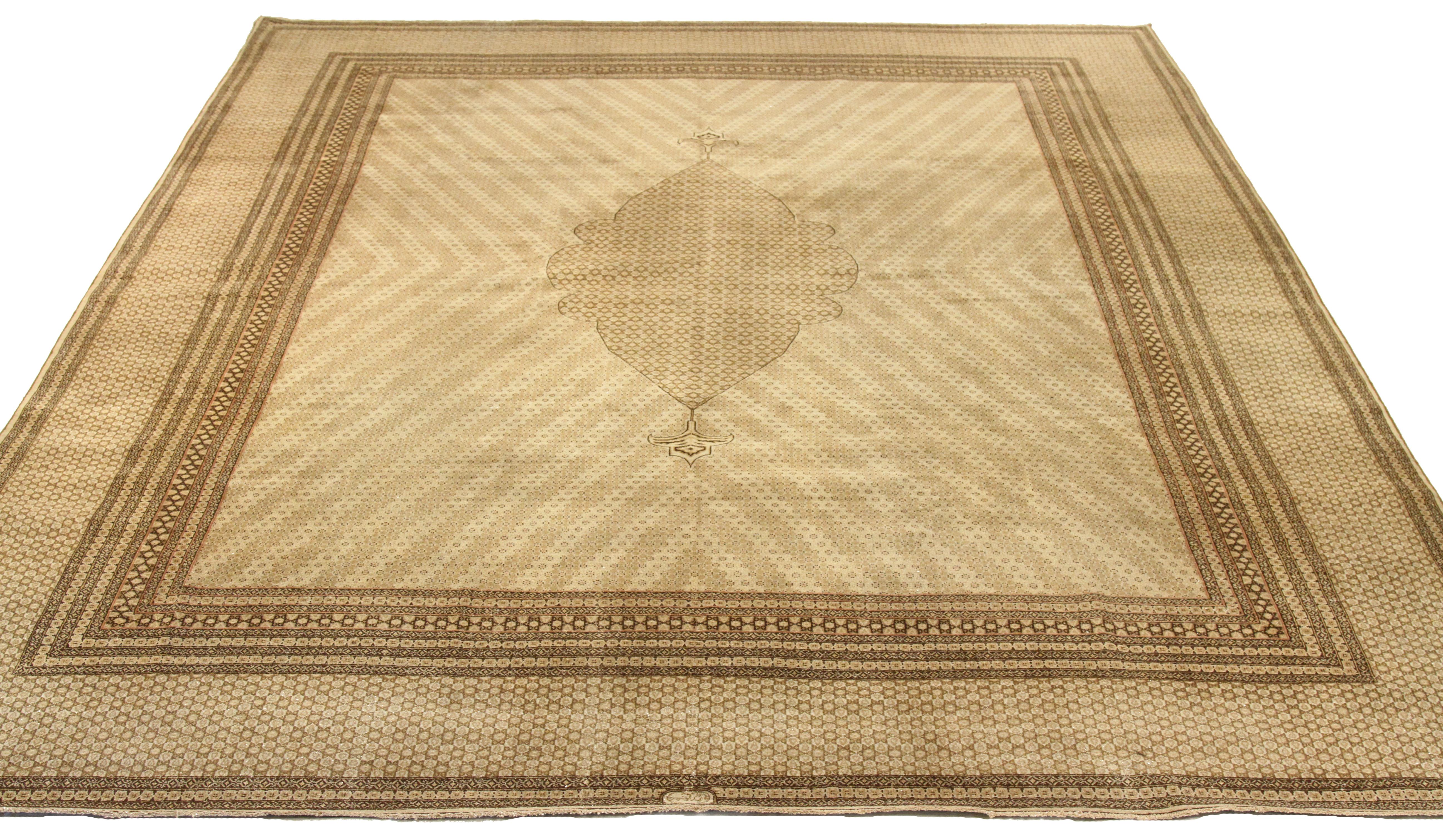 Antique hand-woven Persian area rug made from fine wool and all-natural vegetable dyes that are safe for people and pets. It features traditional Kerman weaving depicting 