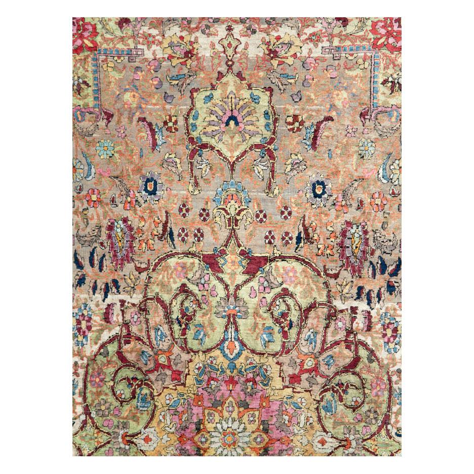 An antique Persian Silk Kashan accent rug handmade during the turn of the 20th century.

Measures: 6' 9