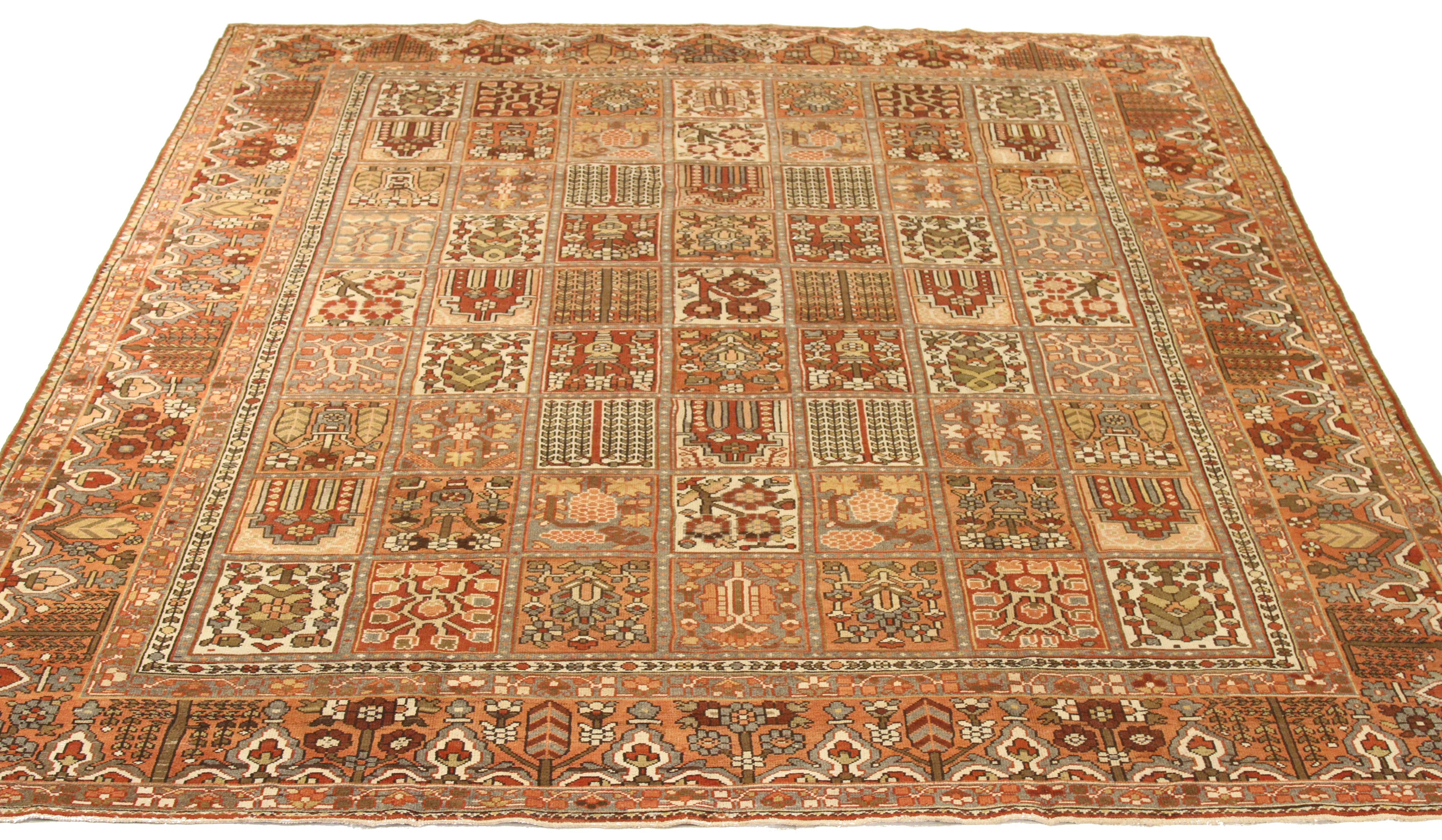 Antique handwoven mid-20th century Persian area rug made from fine wool and all-natural vegetable dyes that are safe for people and pets. This lovely piece features a rich field of tribal details in various colors which is the traditional weaving