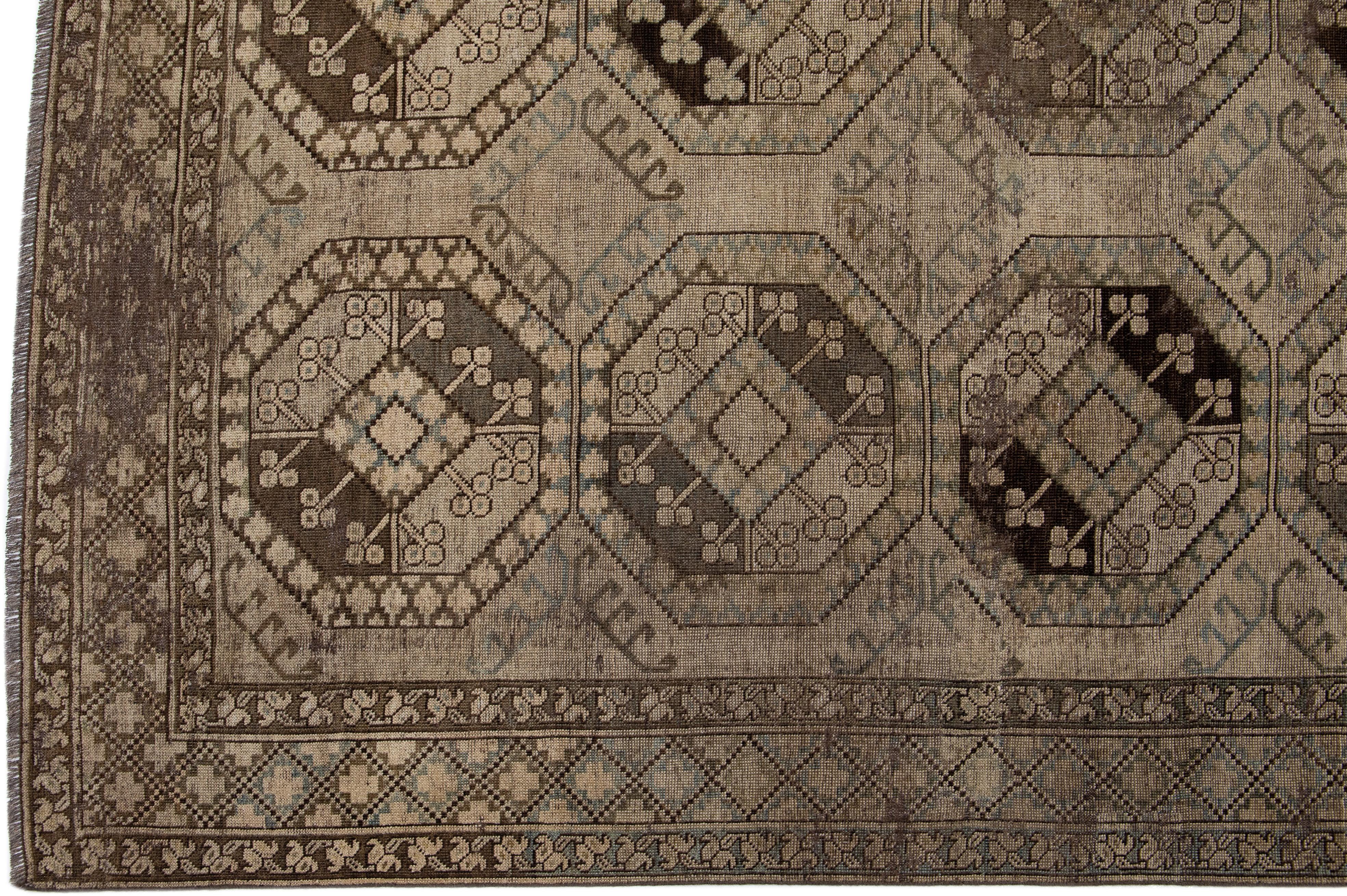 Islamic Antique Handmade Persian Turkmen Wool Rug with Geometric Motif in Light Brown  For Sale