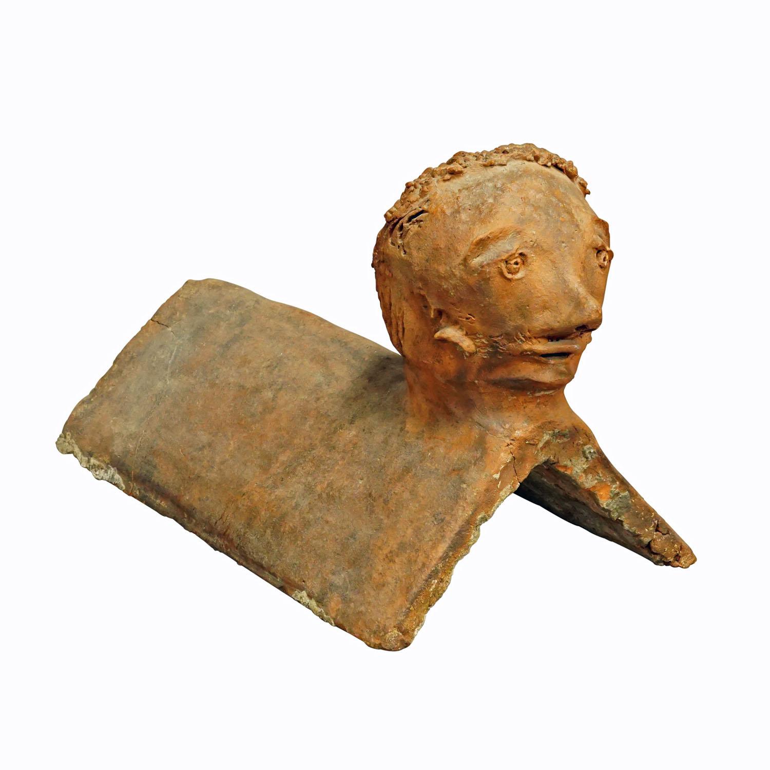 Antique Handmade Roof Rider Brick, Germany 1844

An antique roof rider made of clay featuring a head in outsider art style. Handmade in Germany in 1844. Good condition, one edge cut of. Inscribed signature with the year of manufacture on one