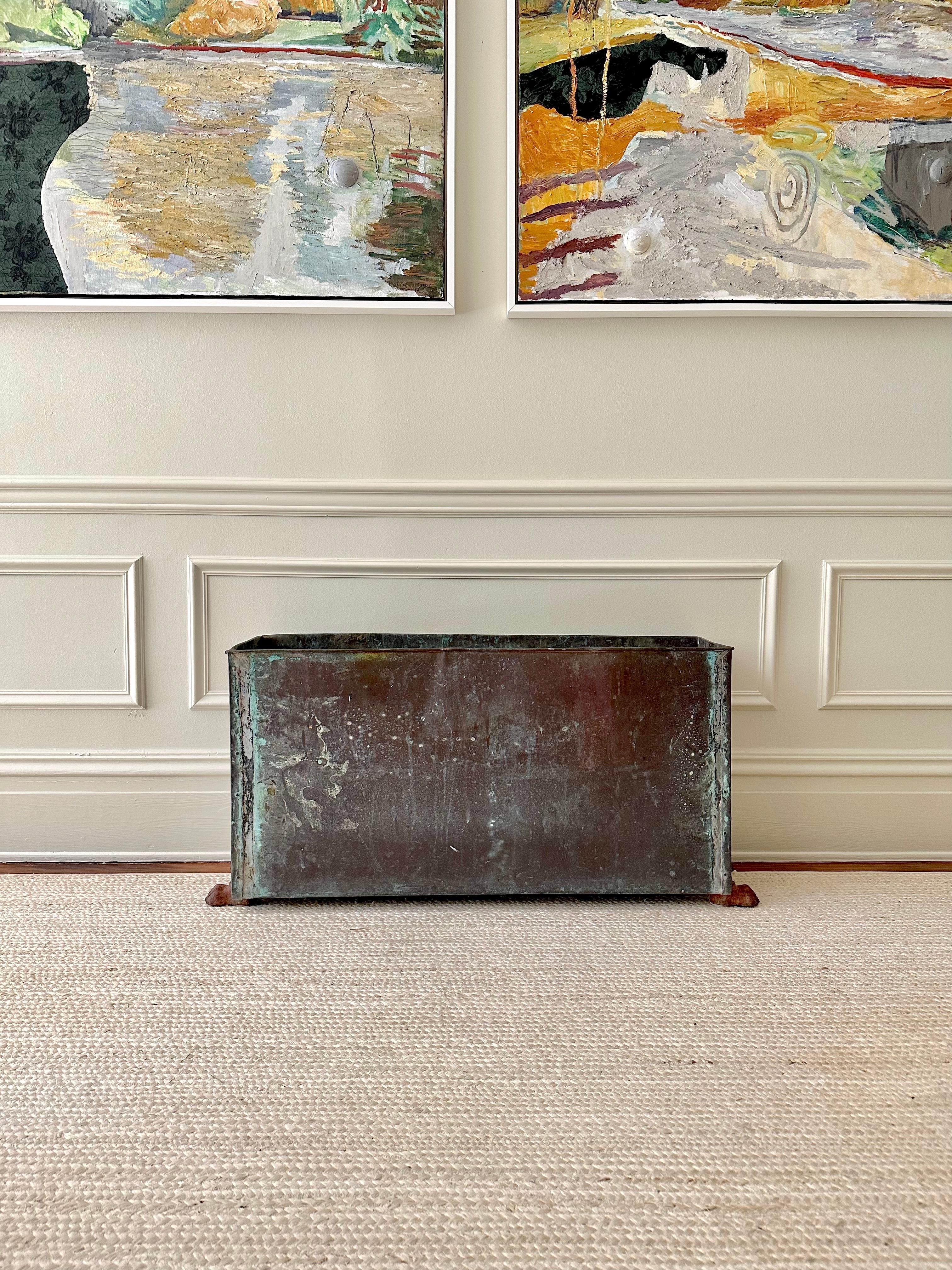 An elegant artisan-made example of an early 20th century copper garden planter with a hand rolled top edge and beautiful, time-worn verdigris patina.  I love this piece in a window or in an entryway under a remarkable piece of art.

Planters like