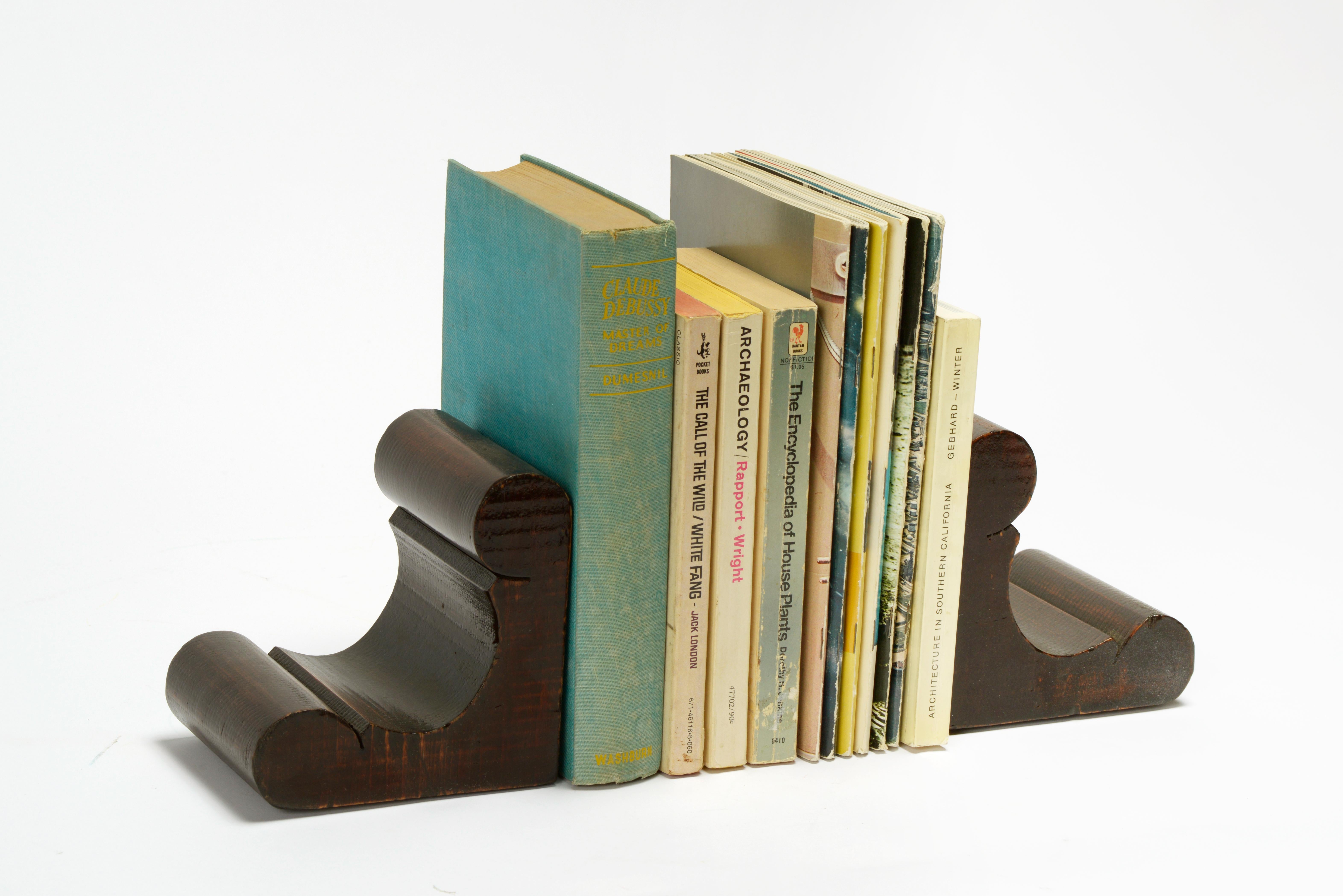 Lovely antique wood bookends, cleverly constructed as a single unit. Handmade and stained in walnut. A beautiful and practical addition to your traditional living room or library. 

Dimensions: 16